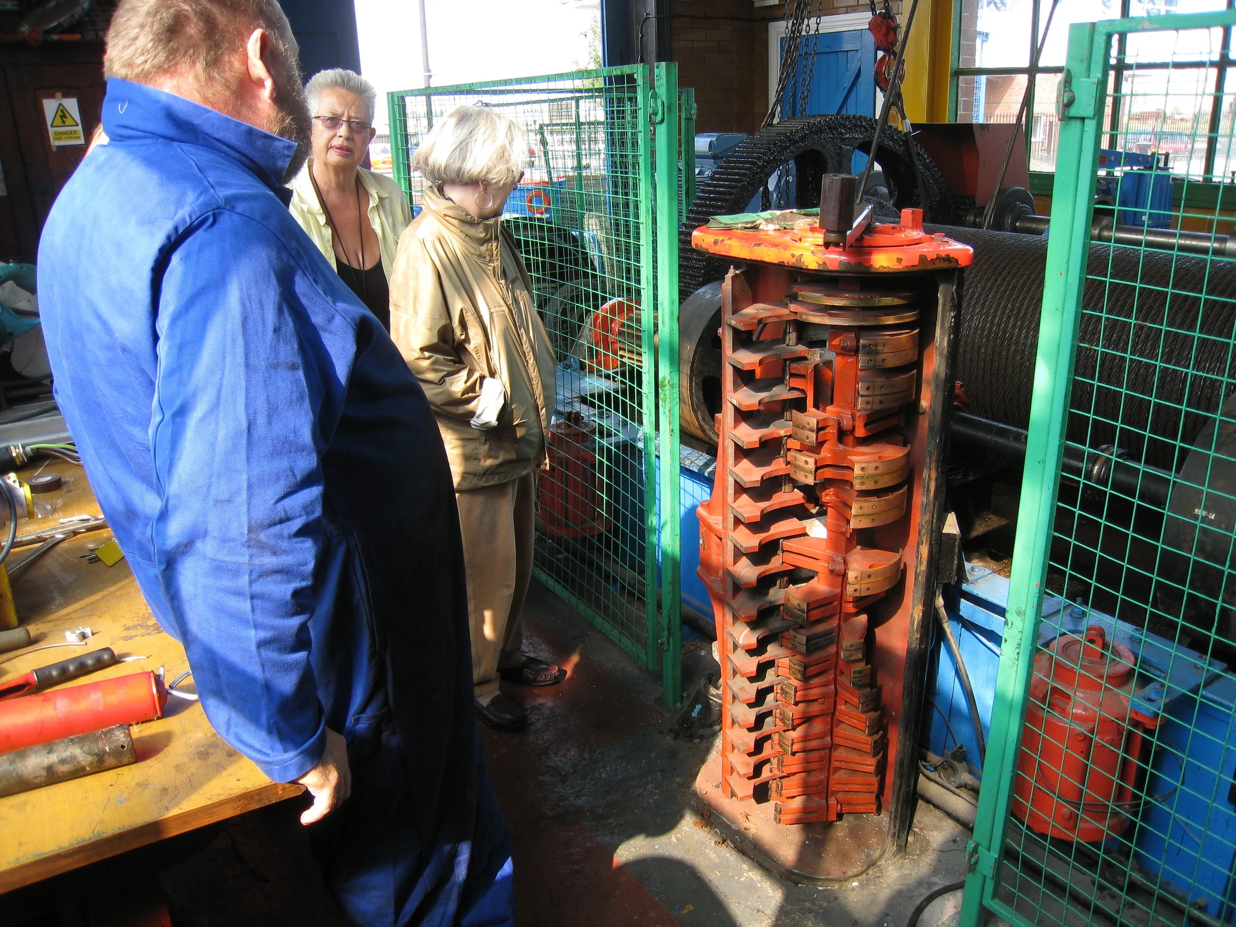  Middlesbrough--Transporter Bridge engine room--Controller with operator, Maggie Hall and Carrol Kindel 