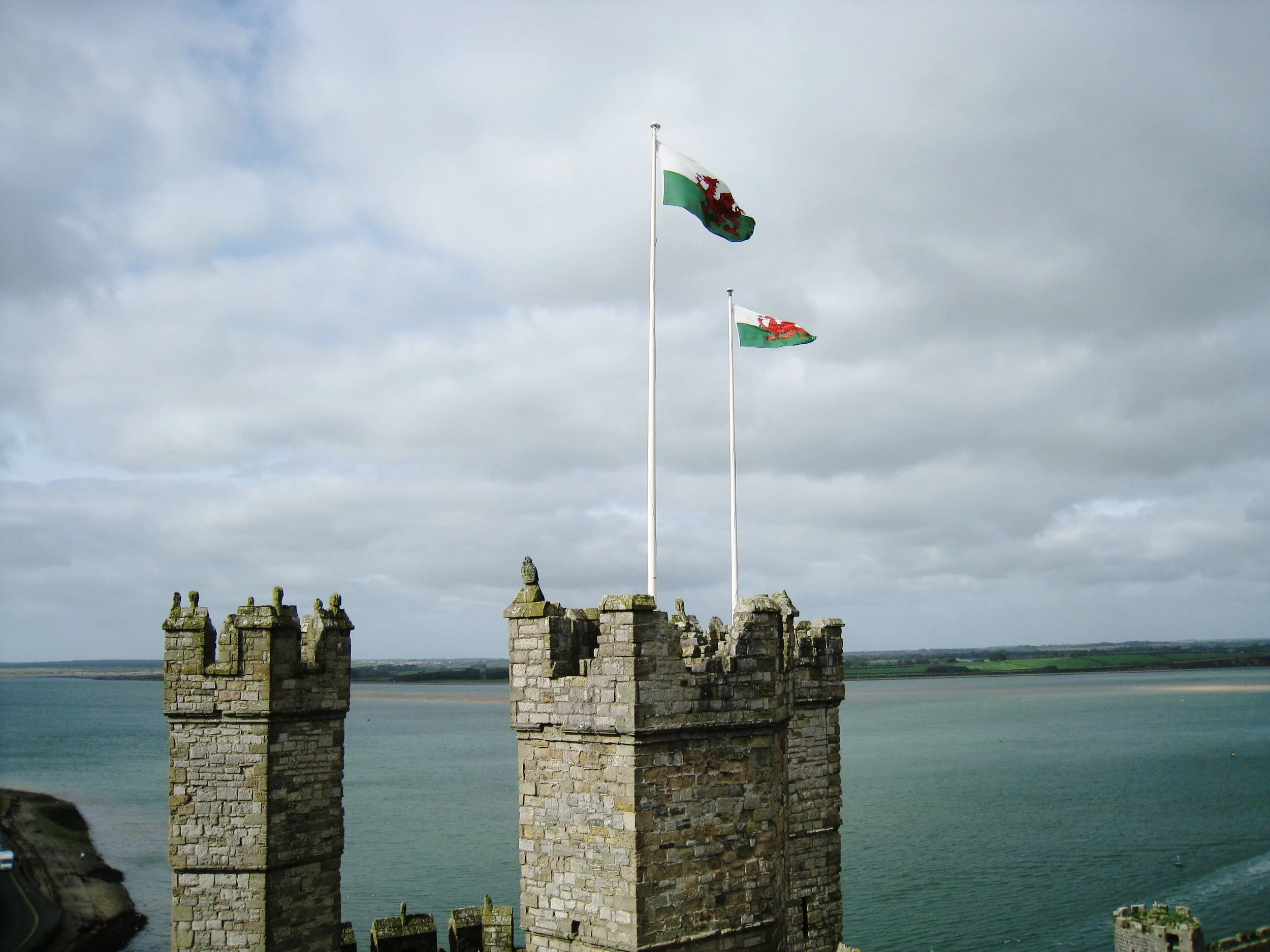  Caernarvon--Castle towers with Anglsee behind 
