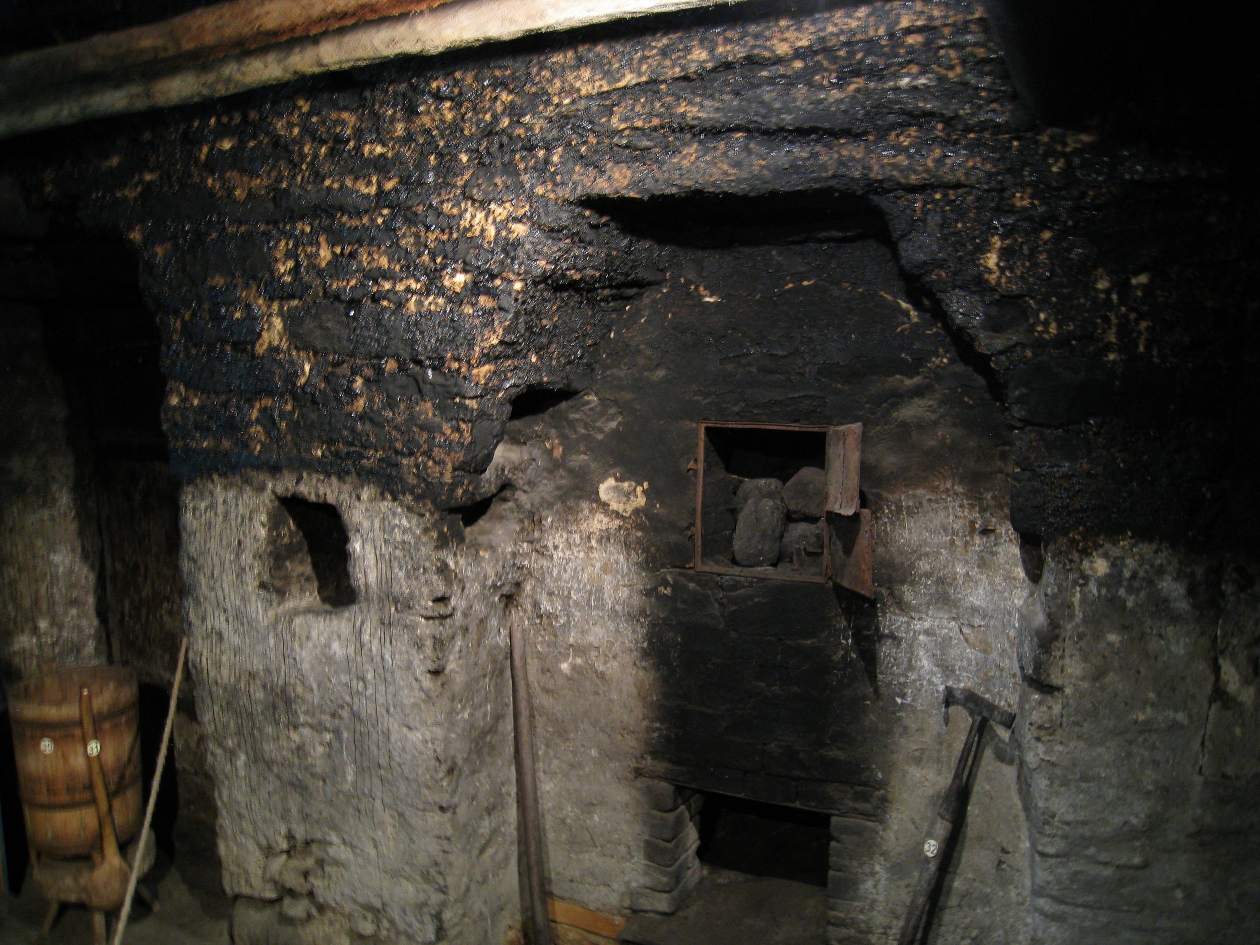  Saaremaa--Viki--Mihkli Farm Museum--Preserved farm--Main house--Smoke and cooking room stove (note charred walls and ceiling) 