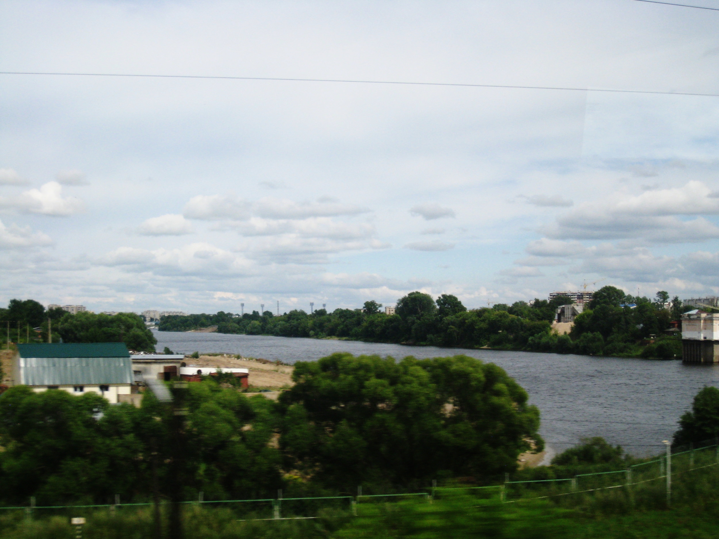  Russia--View from the train between St. Petersburg and Moscow--Small town along a river 