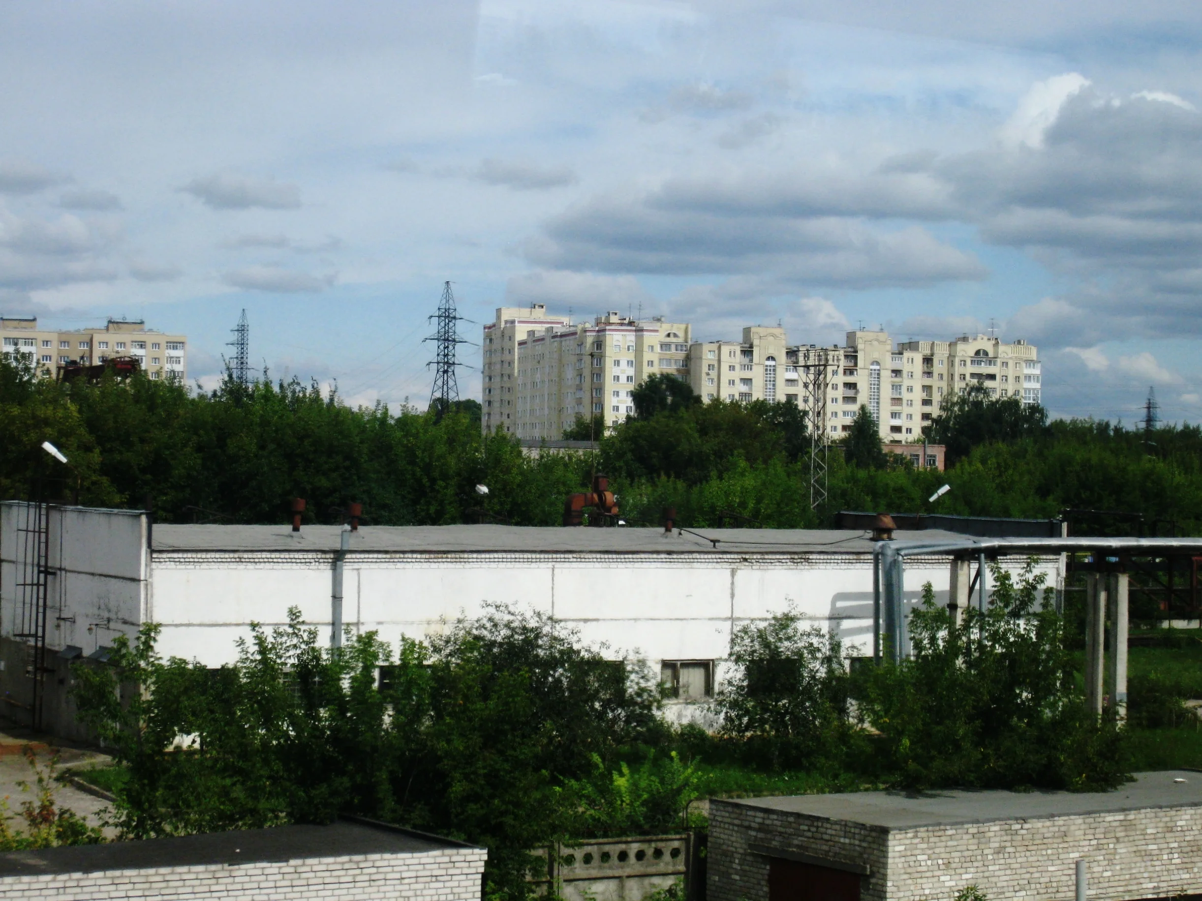  Russia--View from the train between St. Petersburg and Moscow--Industry and housing along the rails 