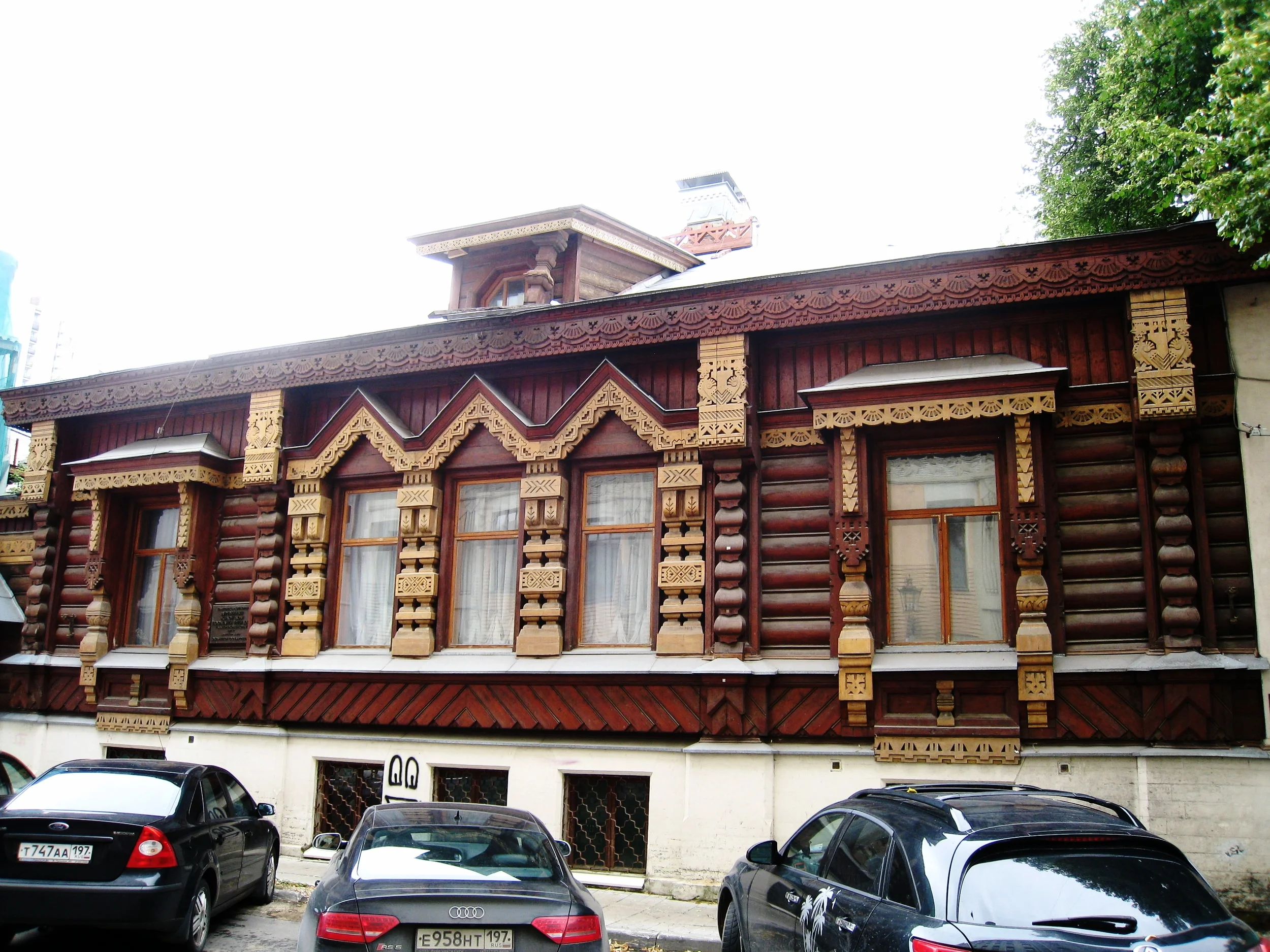  Moscow--Arbat--Log house with fretwork showing Russian embroidery styles--near Arbat pedestrian street 