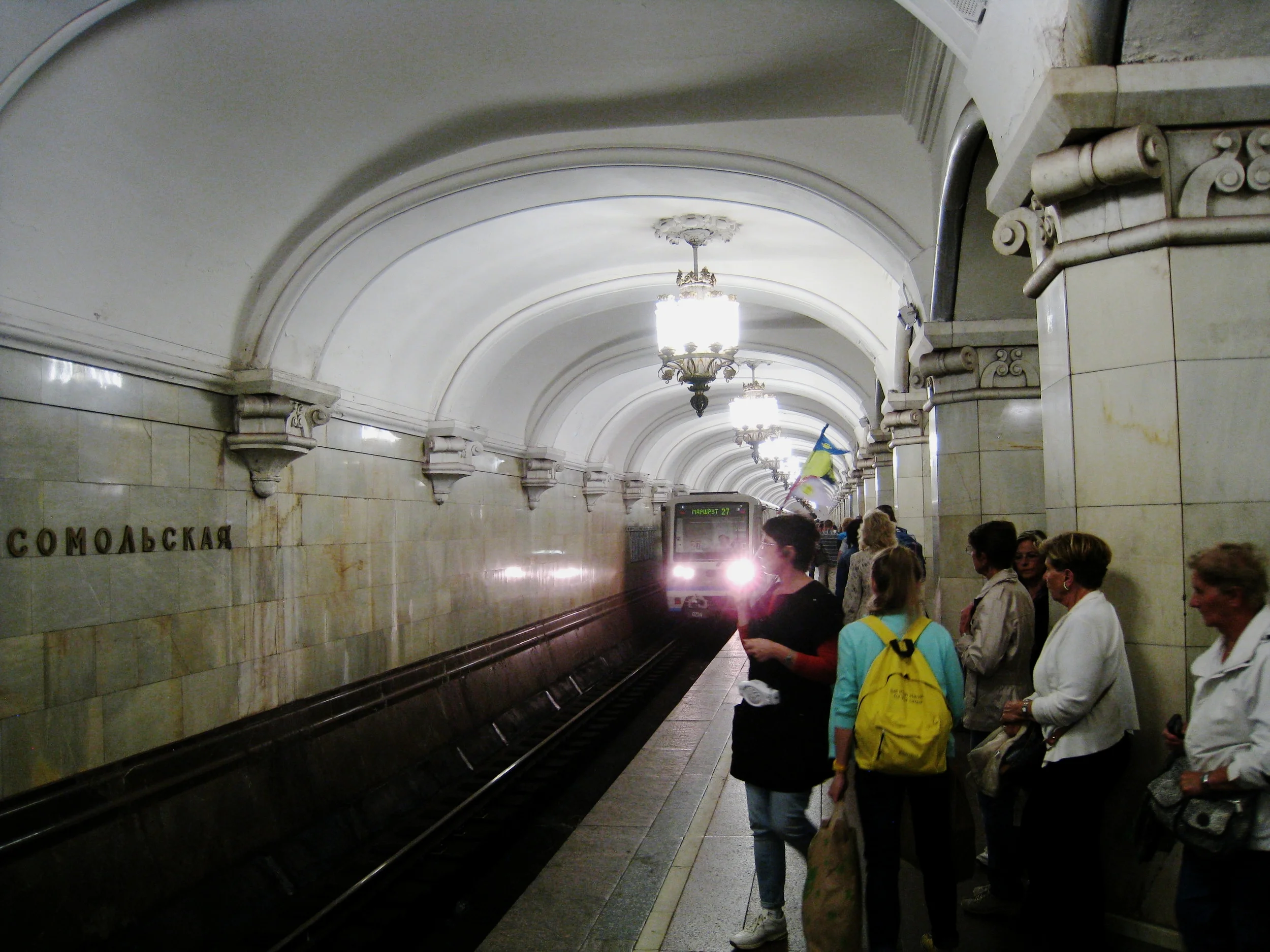  Moscow--Metro--Decorated station--Chandeliers over arriving train 