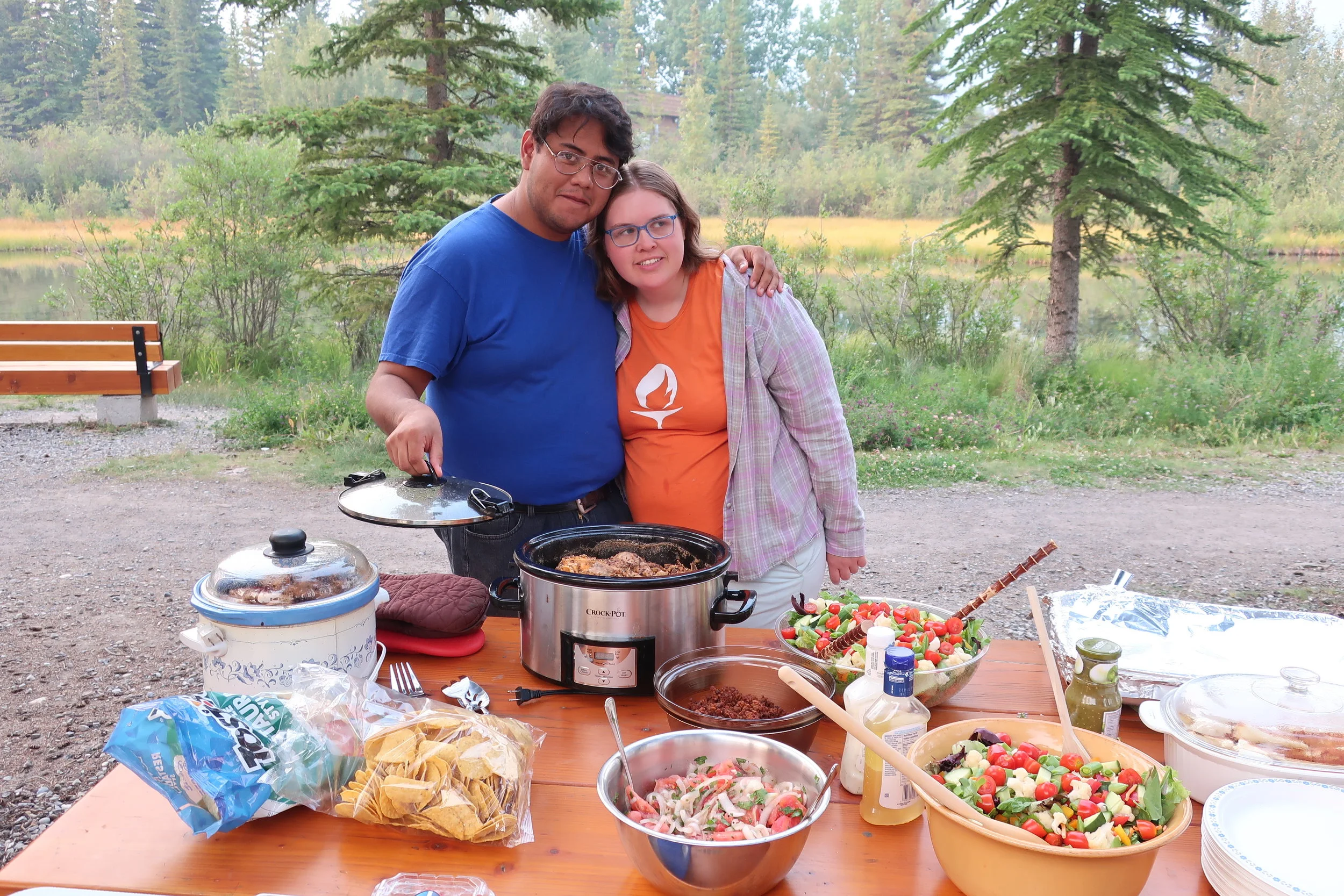  Canmore--Harald and Christin Grieser's 45th Wedding Anniversary Cocktail party-- Arturo Tovar and Christiana Coakley with their wonderful Chicken Pastor (Adobo) meal 