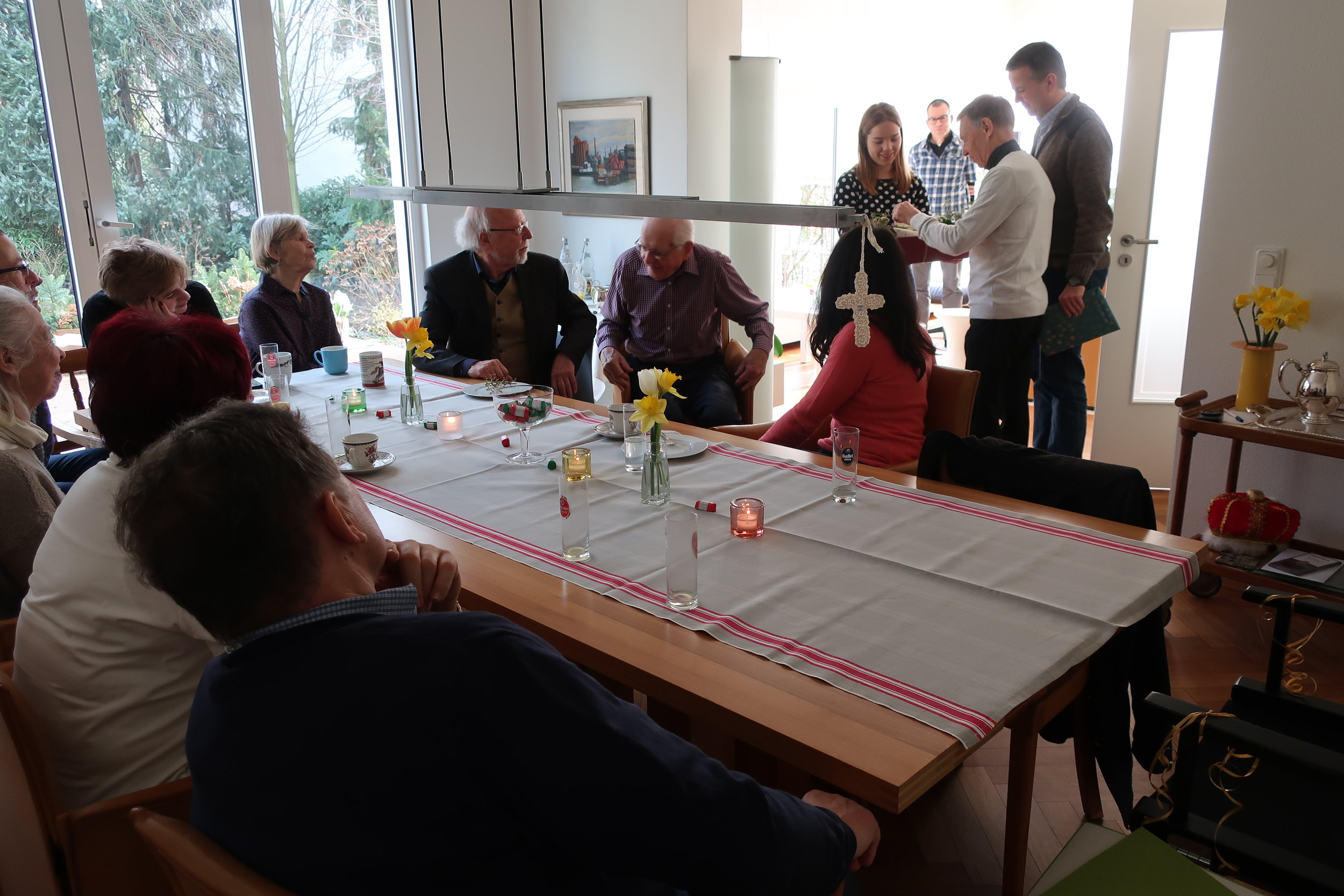  Cologne--Winter 2019--Harald Grieser's 80th birthday--Brunch at Grieser's--Gottfried and Birgit Gruenert, Lis Loesche, Johanna and Paulina Henze, Judy Kindel, Hannes Loesche Paul Kindel and Barbara Kindel with Miriam and Klaus Kindel presenting to H