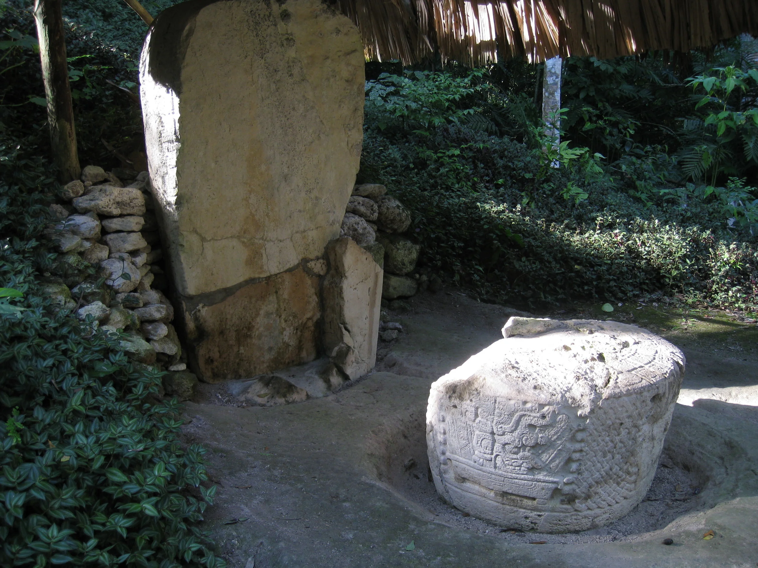 Tikal--Stele and sacrificial stone in back of Temple 3 