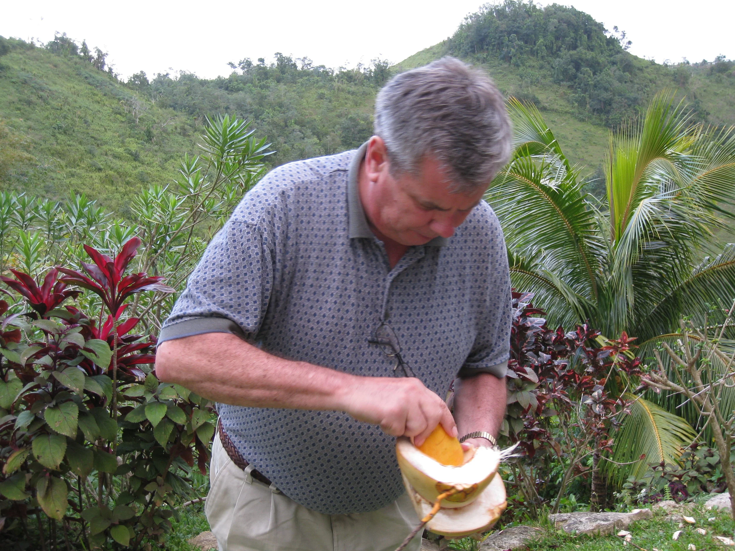  Roger King showing his technique for eating coconut at Cary Lewar's house 