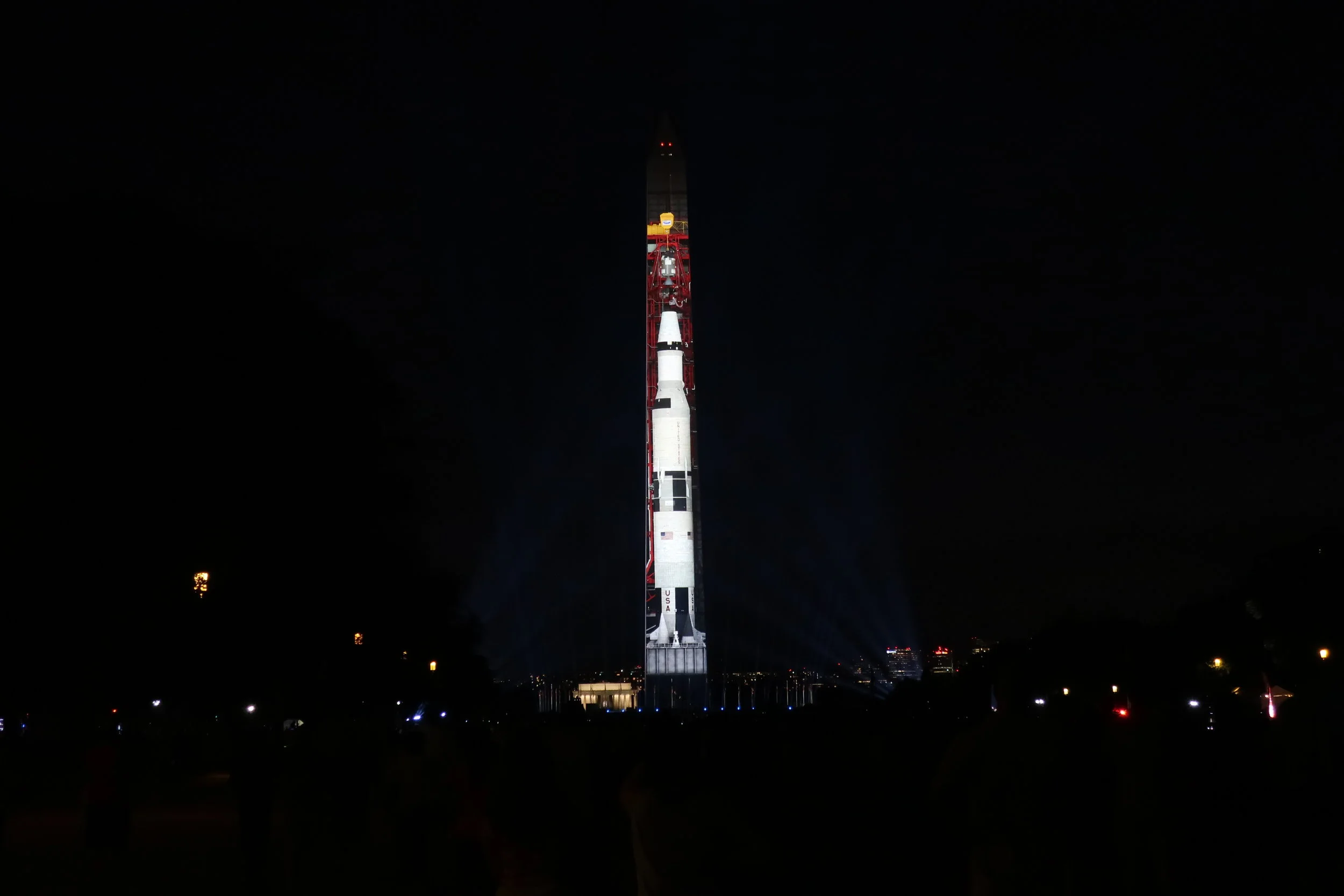  DC 2019--July--Washington Monument--Photos projected on to Monument--Celebration of Apollo 11 Fiftieth Anniversary--Saturn Rocket in place 