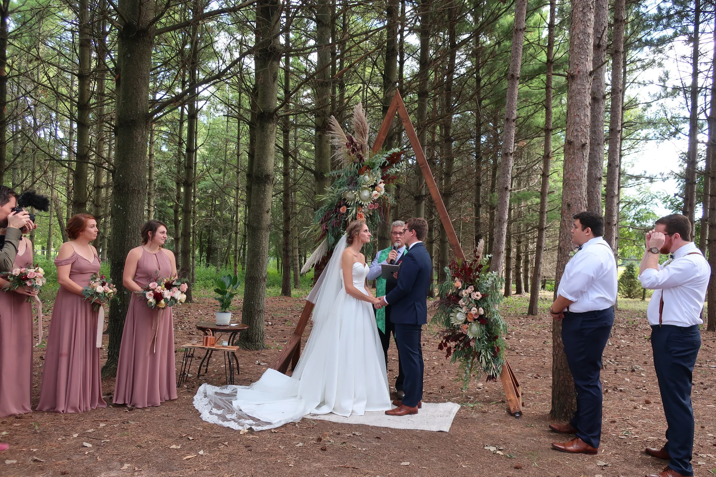  Appleton, Wis.--Sept. 1, 2019--Andropolis-Coakley Wedding--Bubolz Nature Preserve--Alex and Kenzie during the ceremony 
