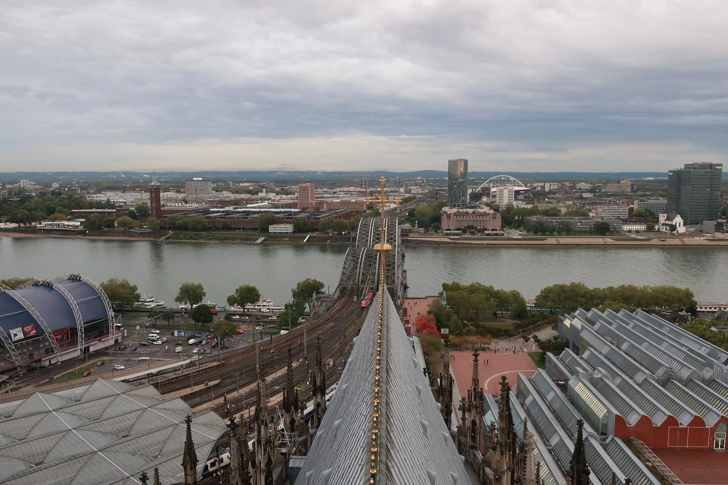  Cologne 2019--Cologne Cathedral insider's tour of the high reaches of the Cathedral--View from the modern steeple--the Rhine railroad bridge with the Cathedral roof in front 