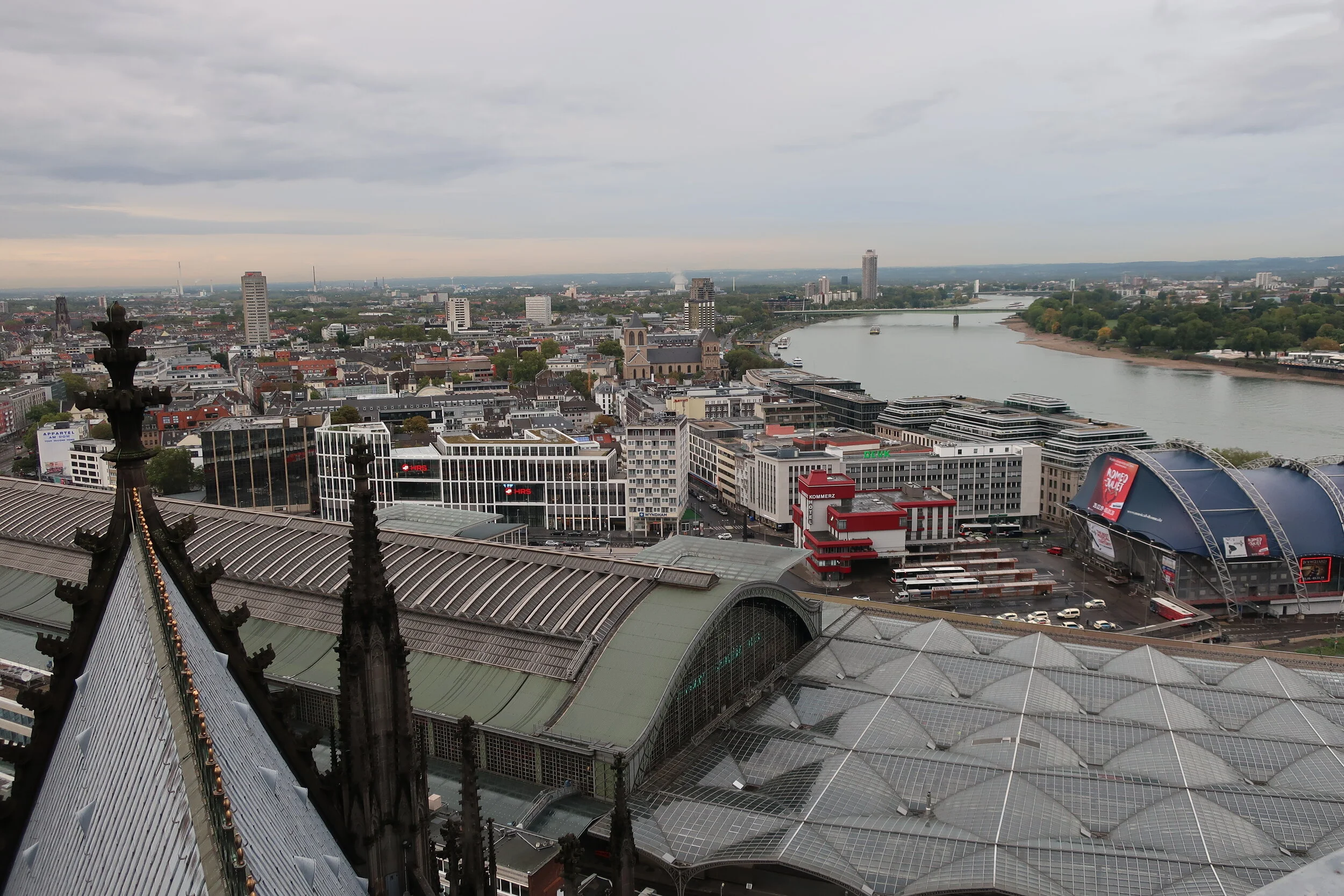  Cologne 2019--Cologne Cathedral insider's tour of the high reaches of the Cathedral--View from the modern steeple--with the Cathedral roof in front looking north over the railroad station with the Rhine river 
