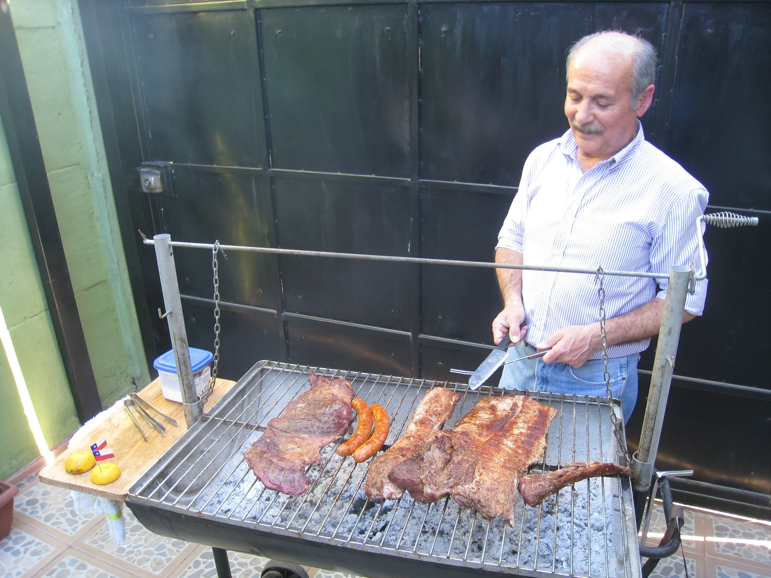  Chile--Curico--Nelson Aguirre and his Chilean Asado at home at Villa El Boldo 1 Pasaje 2 Numero 2010 