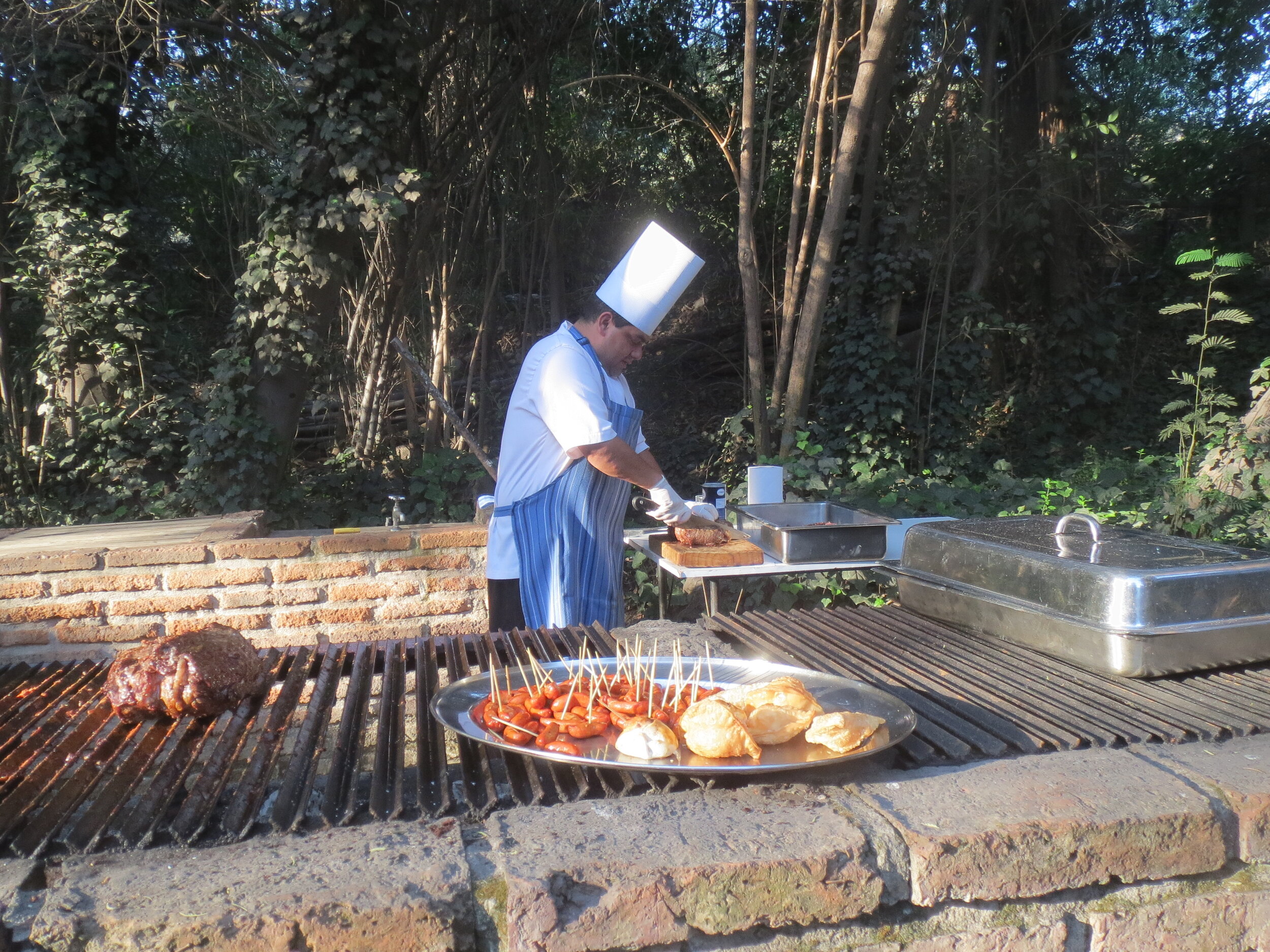  Chile - Santiago: Hotel Acacias de Viticura, Peace Corps Chile Group 23 Reunion; asado; chef preparing the asado, hors d'oeuvres 