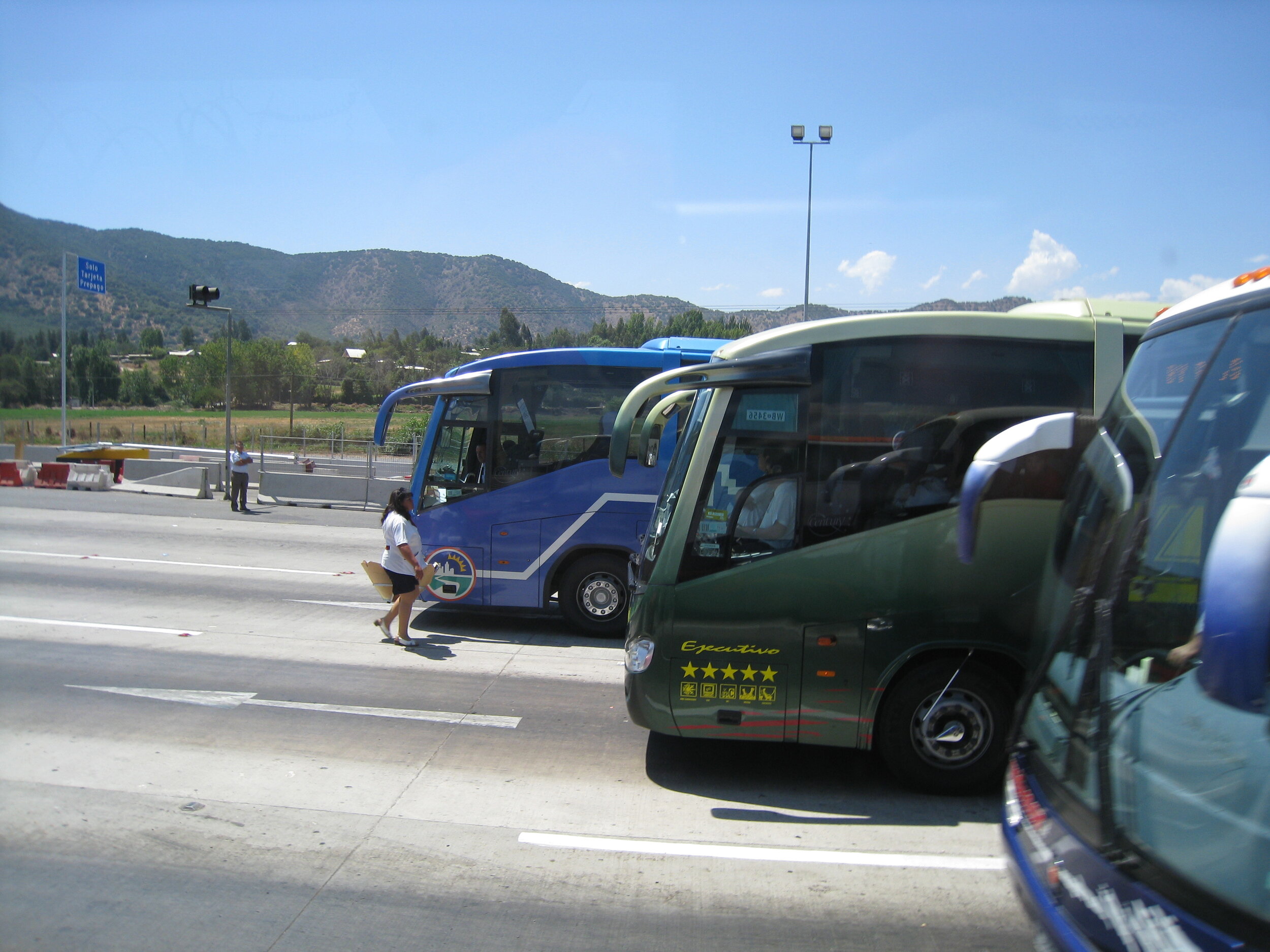  On the road between Curico and Santiago--Bus rush at a toll booth (with vendor) 