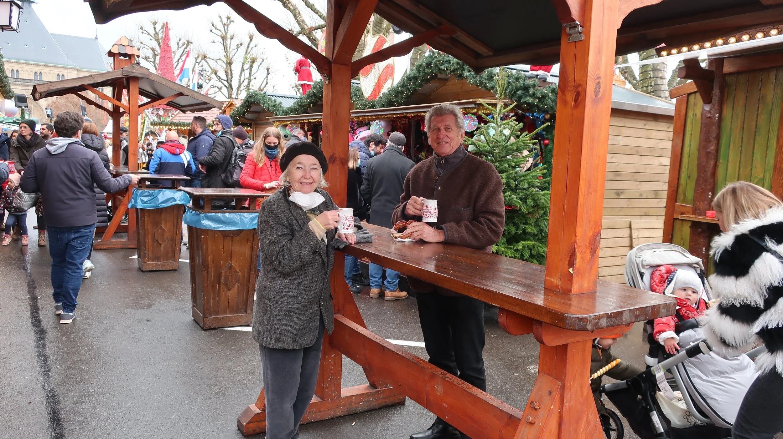  Luxembourg 2021--Place Gella Fra (Constitution)--Holiday decorations and shops--Karl and Carrol with their Gluewein 