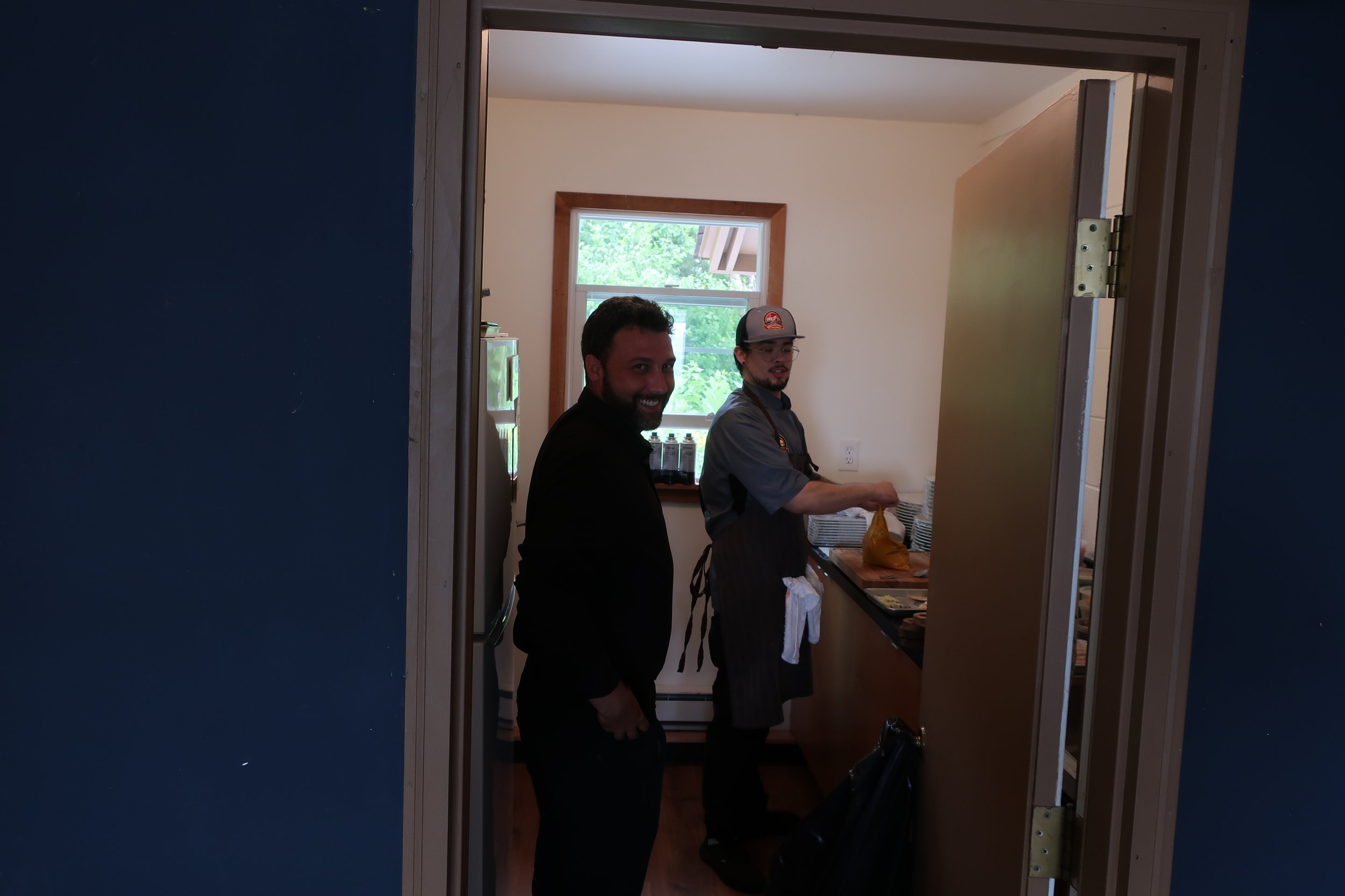  Kent Island--June 2022--50th Wedding Celebration--Server Mike and Chef Ricky preparing food for dinner 