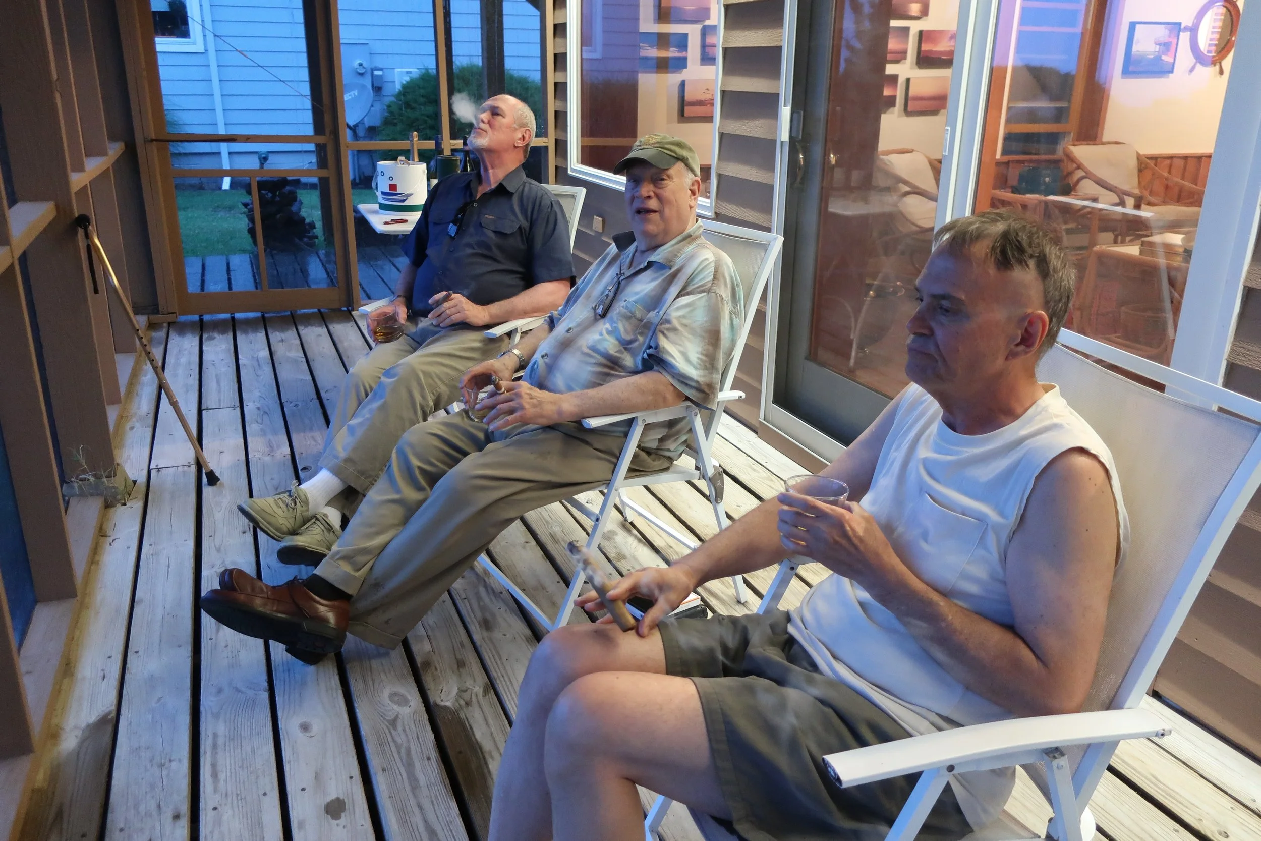  Kent Island--June 2022--50th Wedding Celebration--Rick Schreiber, Jamie Ennis and Steve Kohlhaas after dinner on the screen porch. 