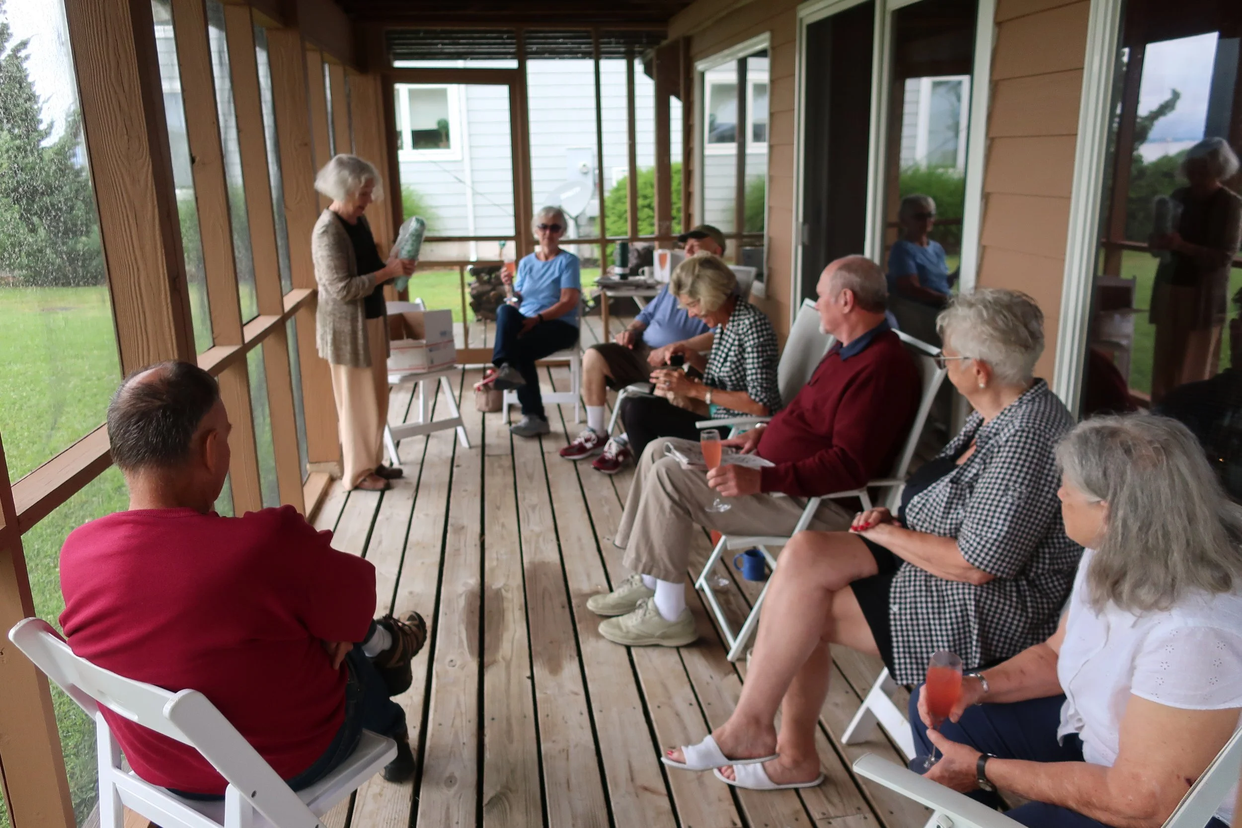  Kent Island--June 2022--50th Wedding Celebration--Carrol Benner Kindel, opening 1972 Chilean bottle of Casa del Diablo wine from Roger King.  Marilyn Fanning, Jamie Ennis, Debbie and Rich Schreiber, Maggie Hall, Jan Ennis and Steve Kohlhaas 