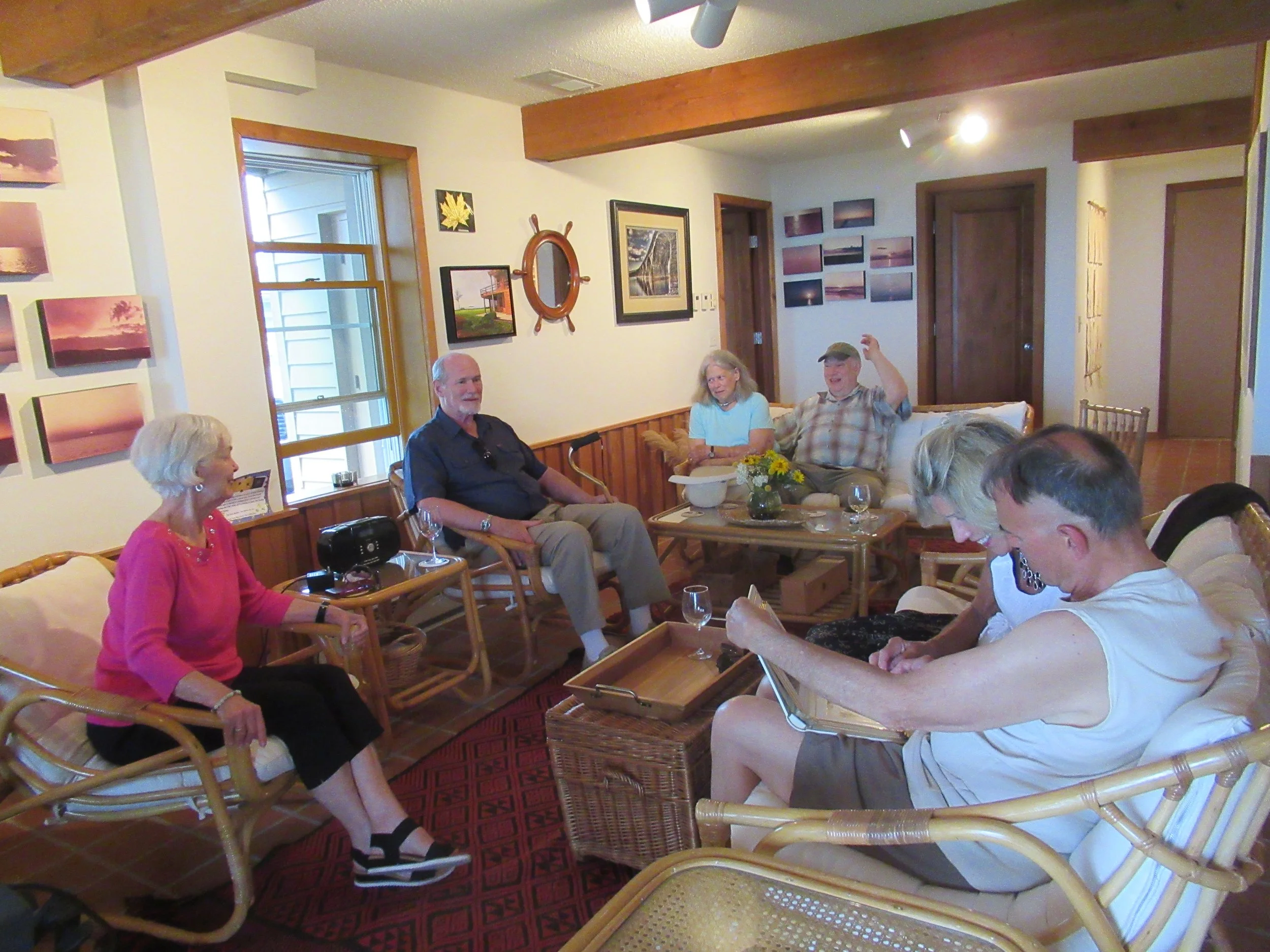  Kent Island--June 2022--50th Wedding Celebration--Rain Delay! We had to eat inside because of lightning and rain.  Conversation while the table was being set up—Marilyn Fanning, Rick Schreiber, Jan and Jamie Ennis, Debbie Schreiber and Steve Kohlhas