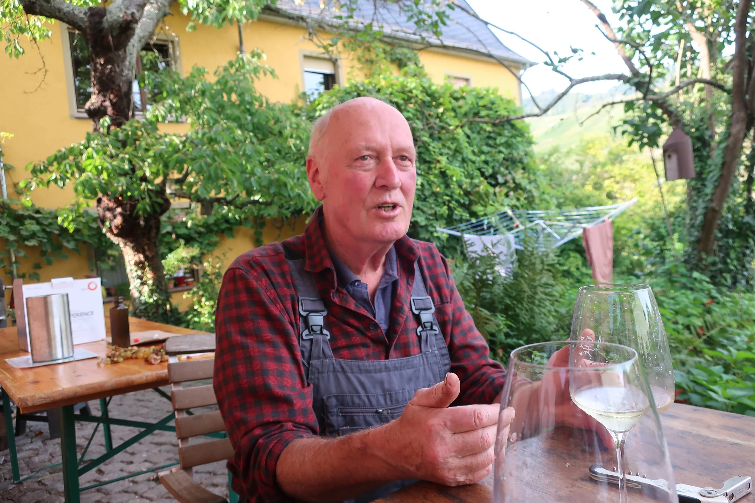  Germany 2023--Kindel 50th Anniversary Trip--Kindel--Vintner and owner Rudolf Trossen with his wines in Kindel 