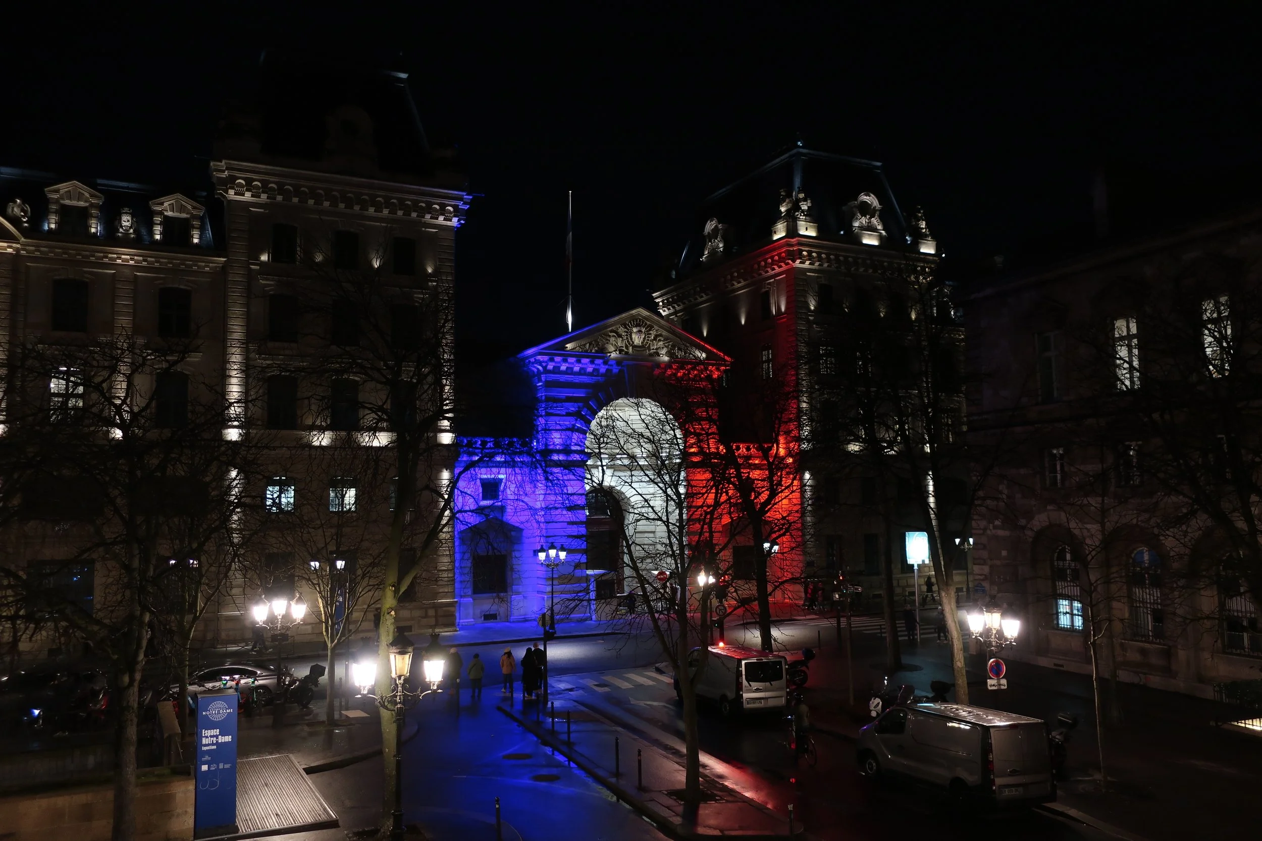  Paris--Spring 2025--From the plaza with Notre Dame at night an official government building 