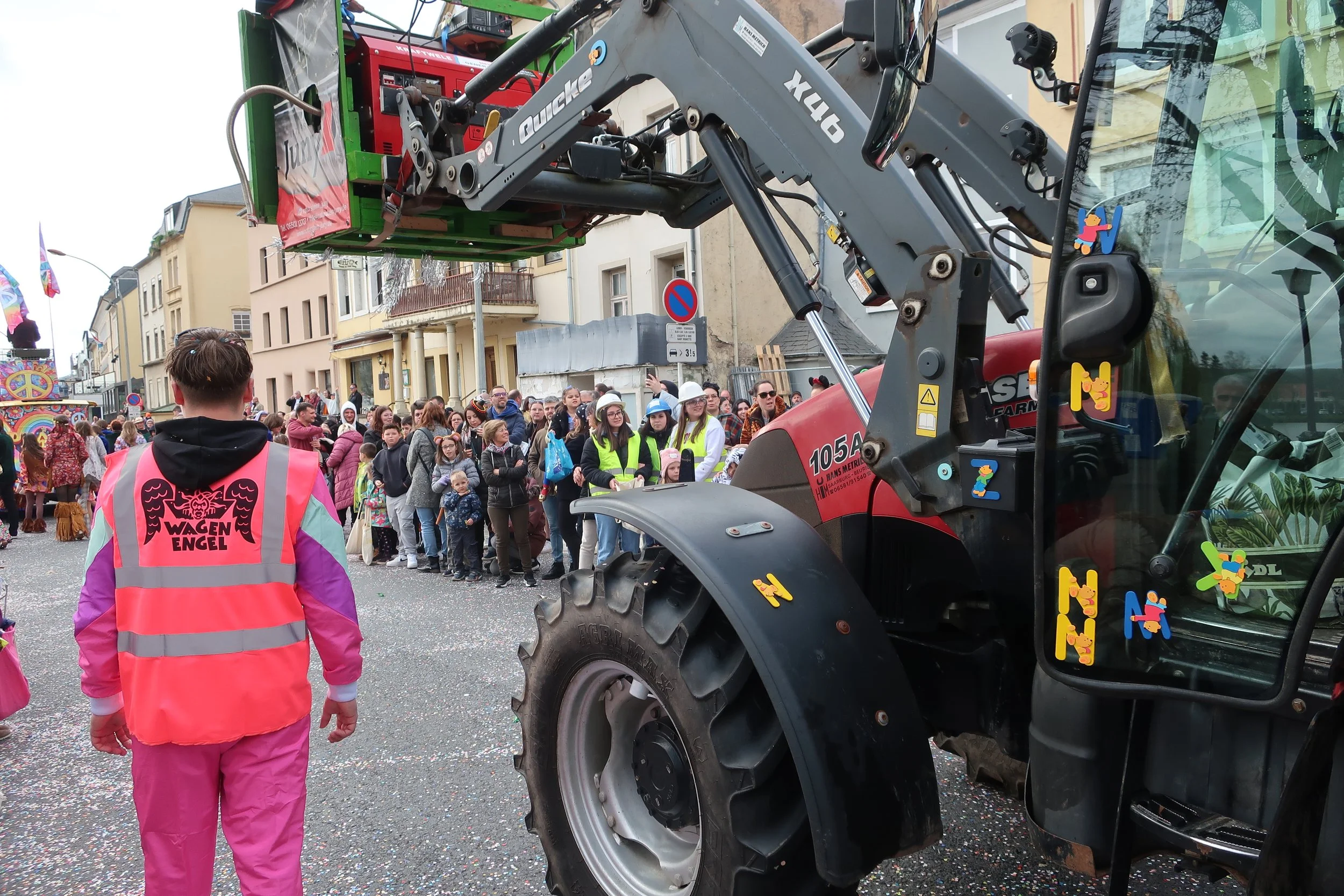  Luxembourg 2025--Remich Cavalcade Celebration--Tractor pulling float with the "Vehicle Angel" making sure no one gets run over 
