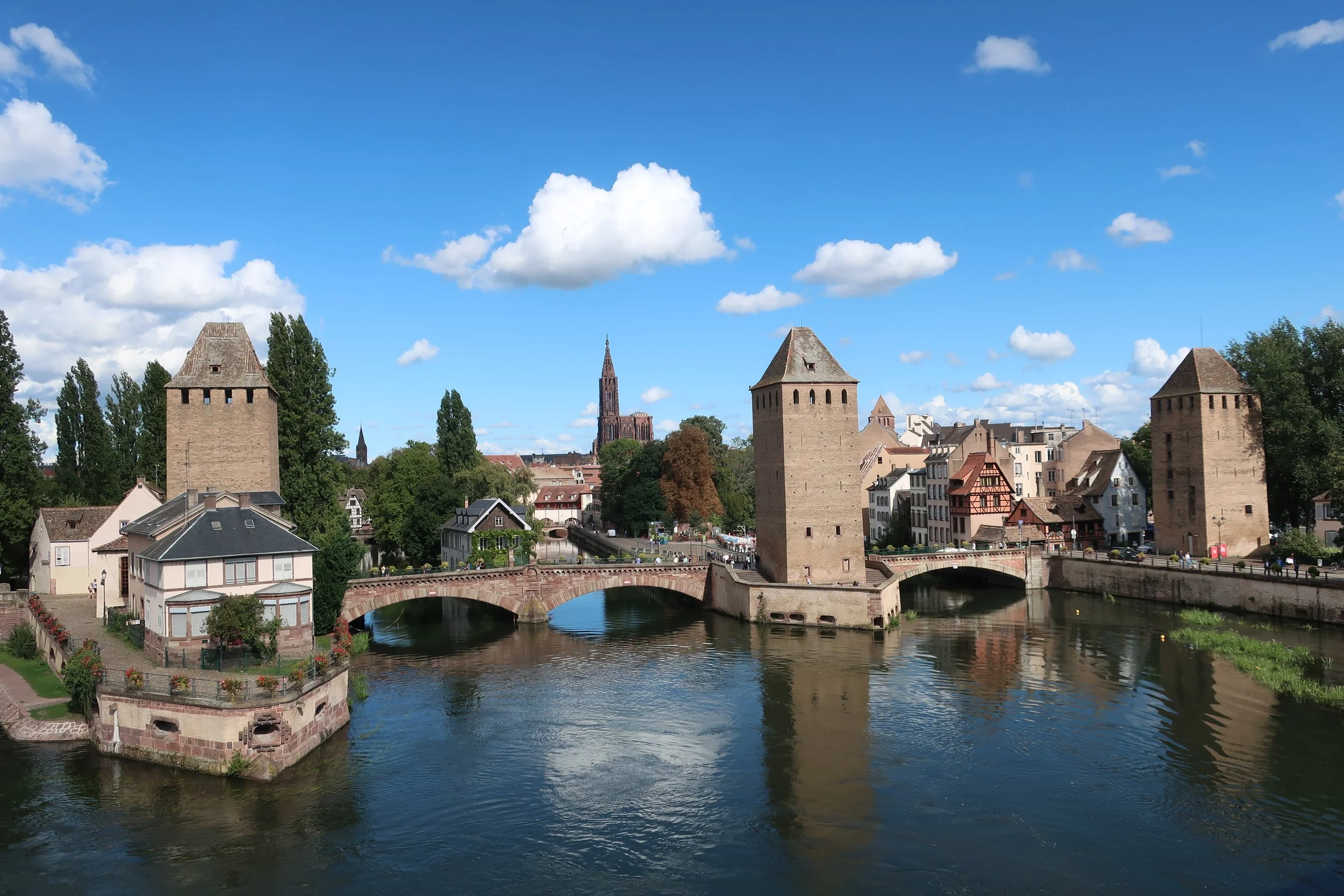  France--Strasbourg 2025--Petite France neighborhood of Strasbourg, from the Barrage (Dam) with the old wall towers and Notre Dame cathedral in the middle 