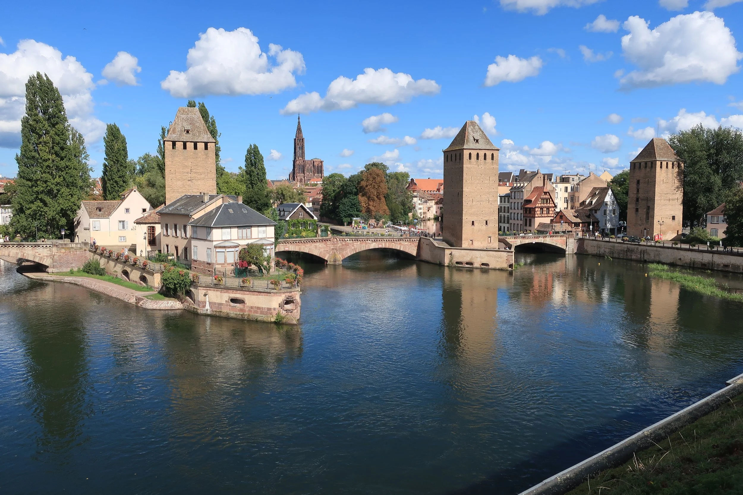  France--Strasbourg 2025--Petite France neighborhood of Strasbourg, from the Barrage (Dam) with the old wall towers and Notre Dame cathedral in the middle 