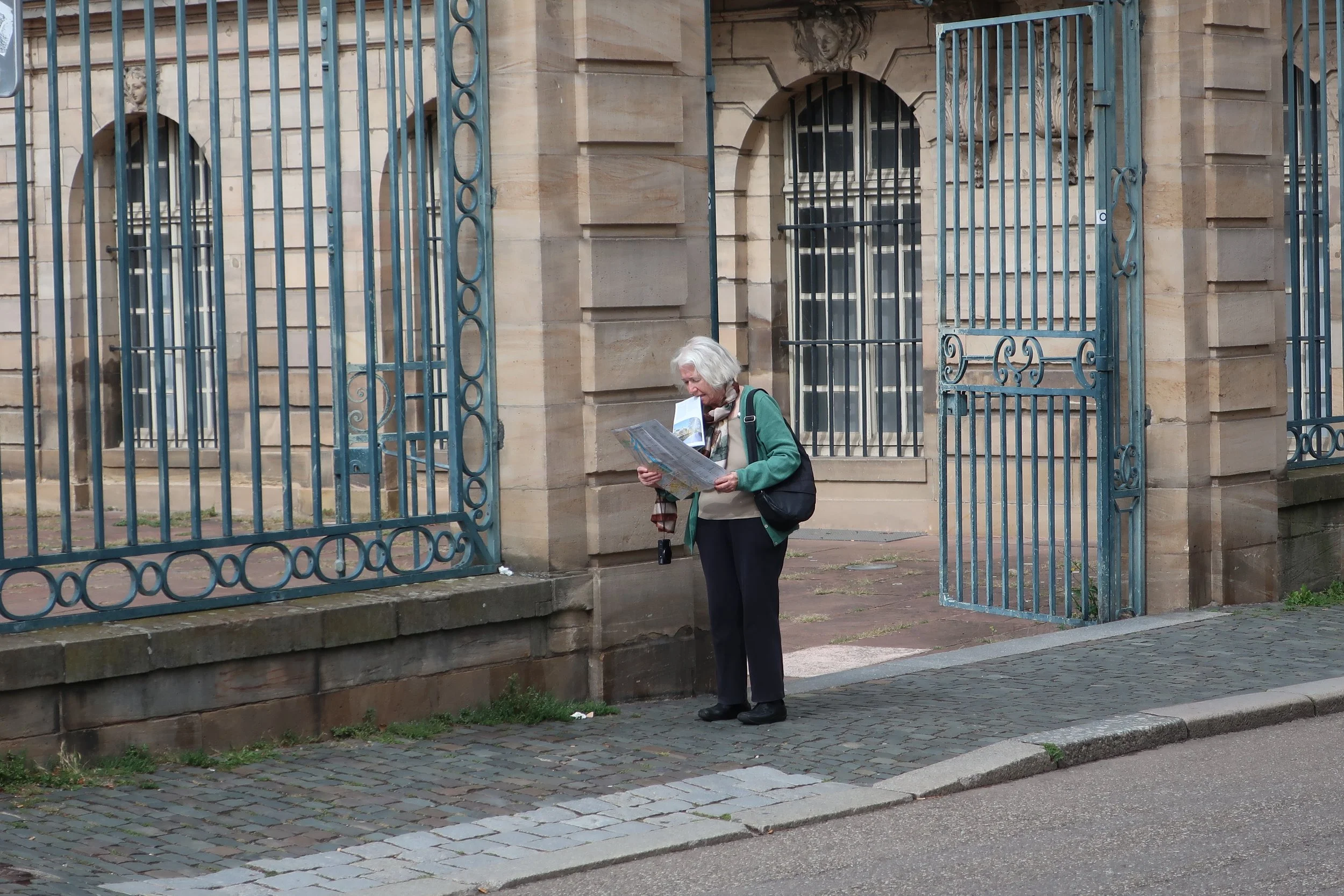  France--Strasbourg 2025--The Harried Tourist trying to find her way (Carrol Benner Kindel) behind the Rohan Museum on the river Ill. 