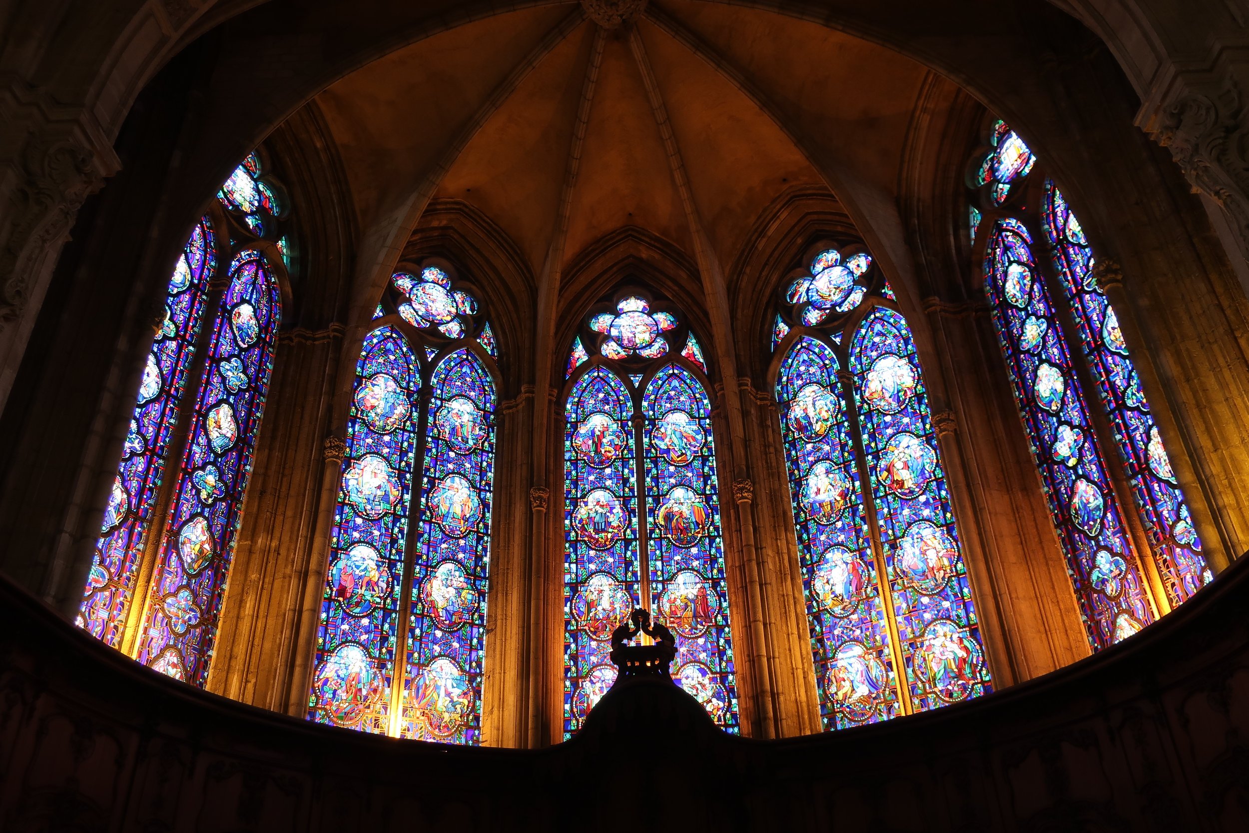 Verdun, France March, 2025--The Notre Dame Cathedral interior,stained glass behind altar 