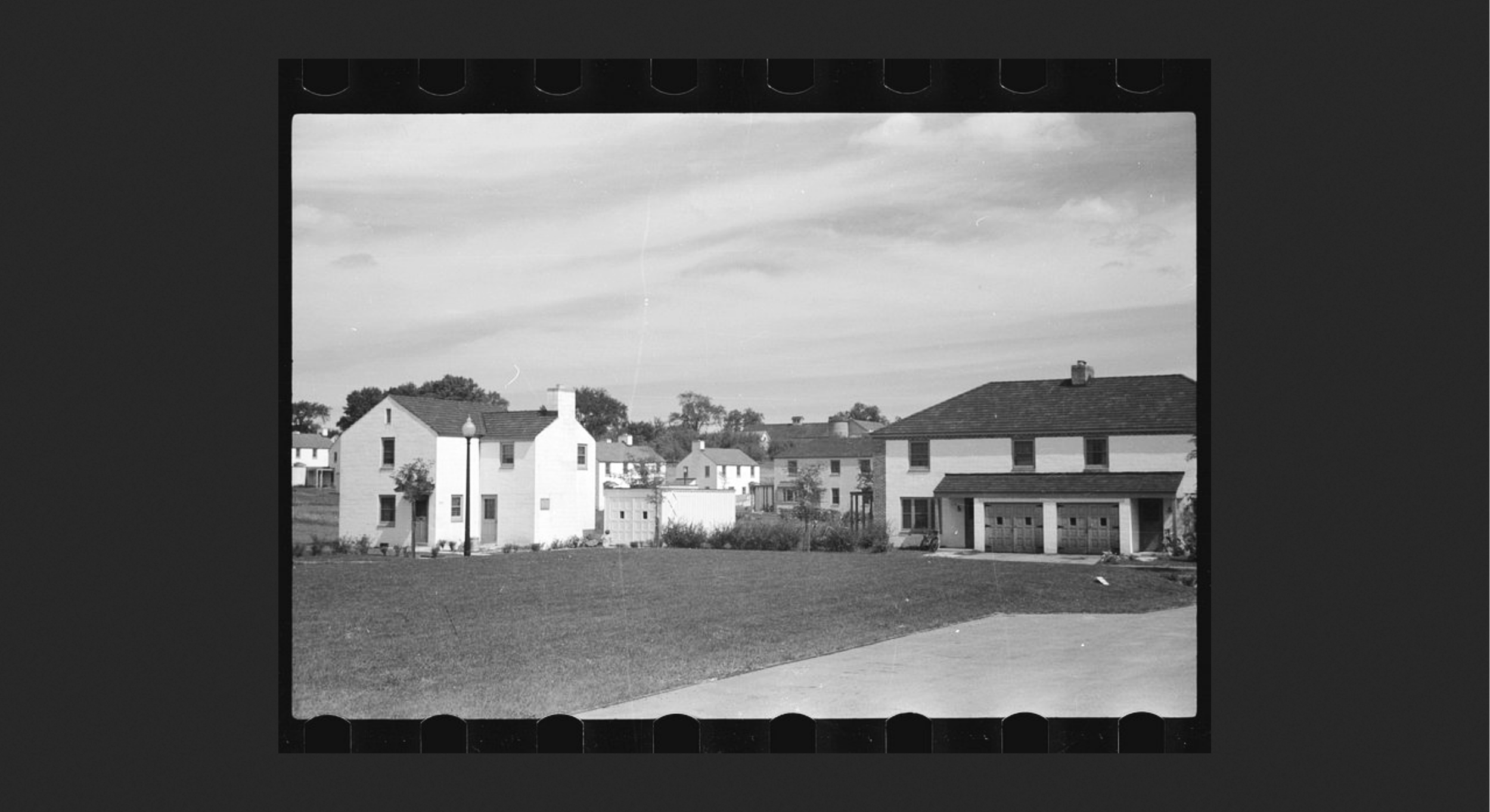   Slide (Different houses):  There were different styles of houses, some single family, and here you see some multiple unit houses, some with apartments for single persons. 