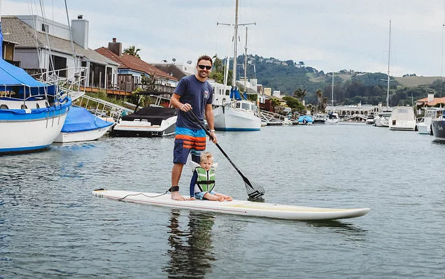SUP paddleboard outdoor activity water nature family time quality time father and son watersports toddler cute fun
