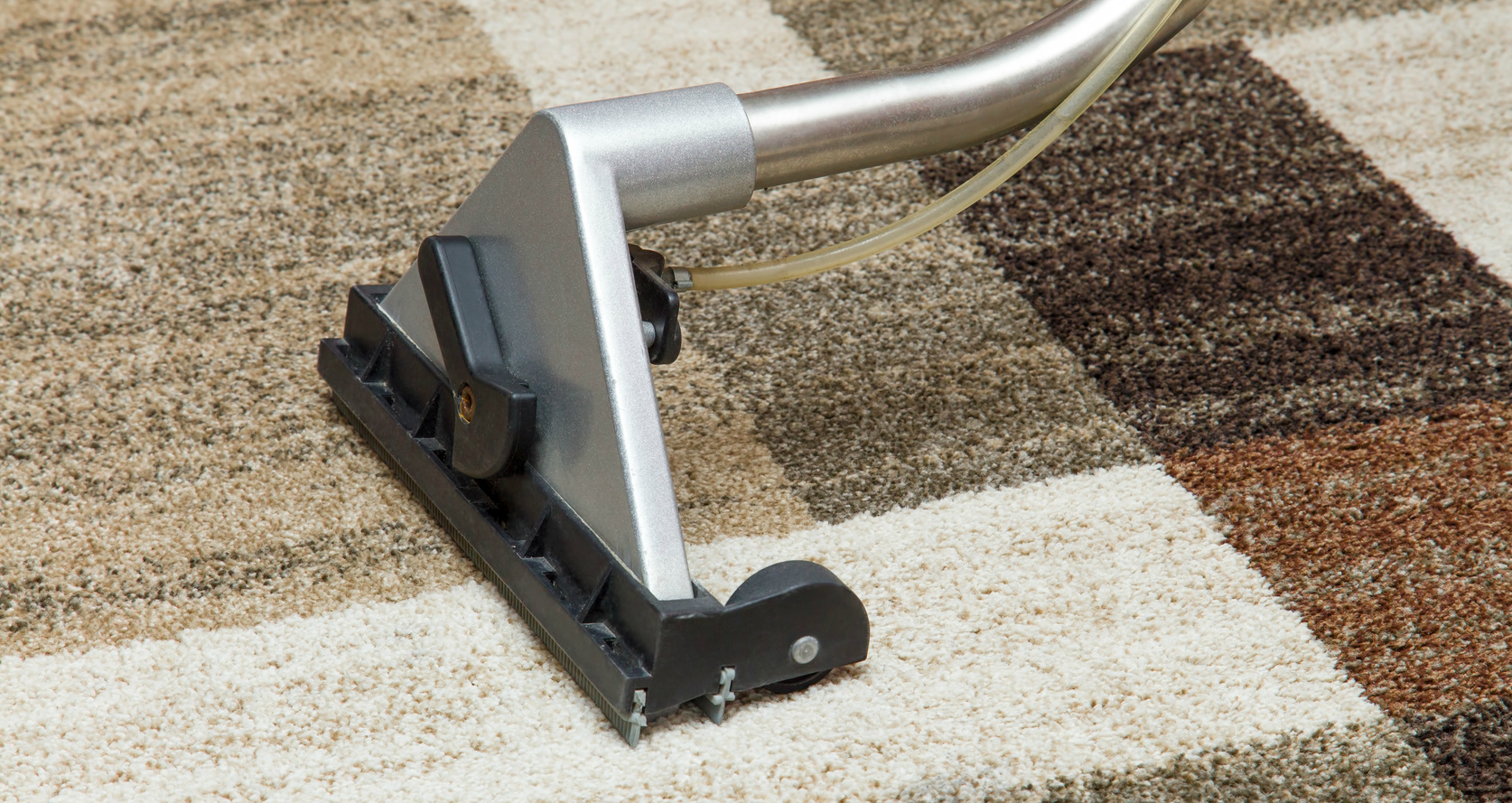 cleaning a carpet with a machine