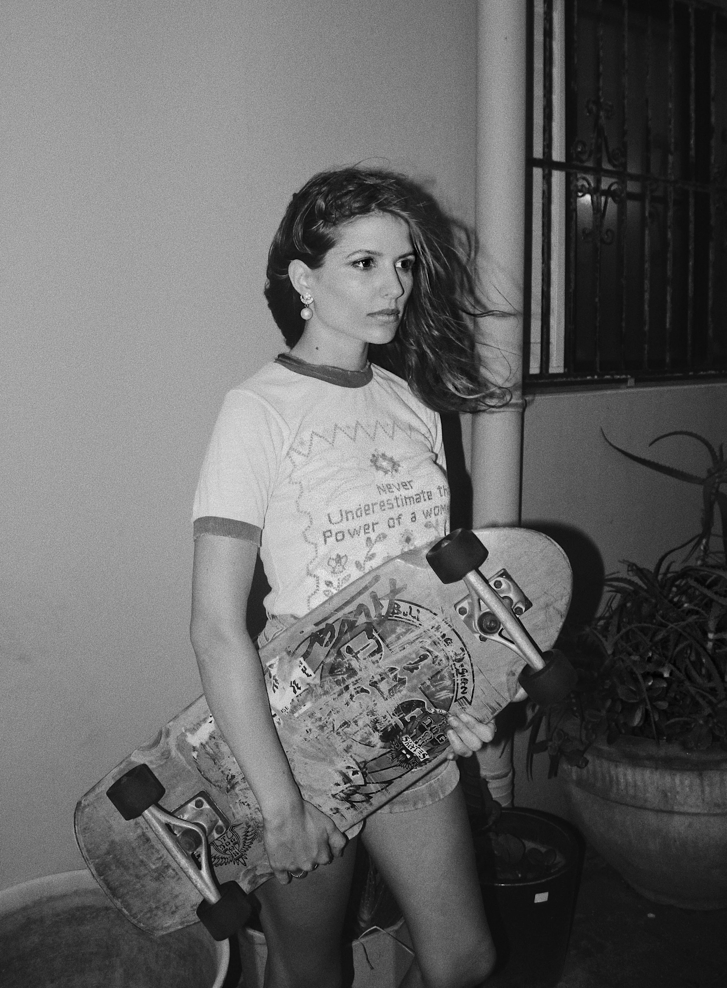 Holding a skateboard is serious business. Obviously.