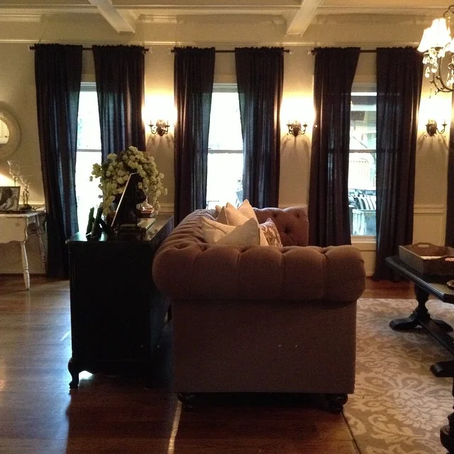 When we bought this custom made Chesterfield sofa, it completely changed our family room! From there, everything took on a life of its own! {Of course then we needed new chairs, a rug, curtains and a whole new paint color..} but you know how that happens, right?!?