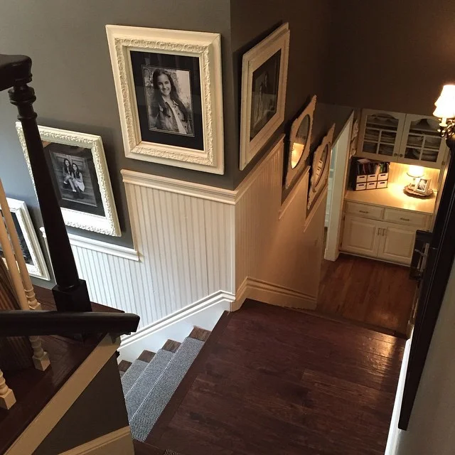 A bird's eye view! Love this wainscoting that my hubby installed for me! It's the perfect fit for this staircase and these antique frames make my ❤ swoon! 