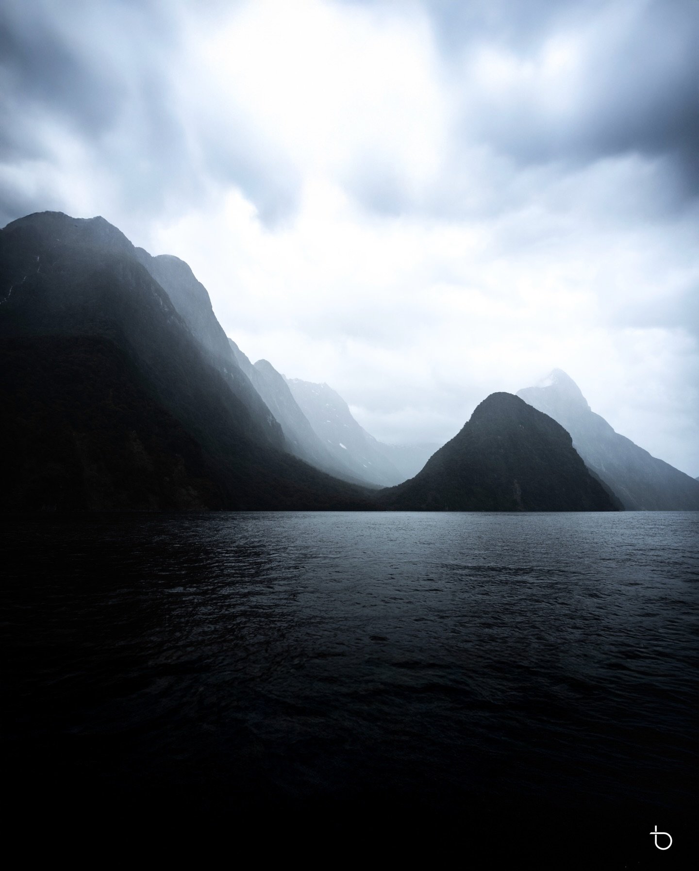 Moody Milford Sound - Mist, mountains, and water moving with quiet power&mdash;Milford Sound in its raw, untamed mood. Where silence speaks louder than words.
.
.
.
#MilfordSound #NewZealand #Fiordland #NatureLovers #Wanderlust
#TravelPhotography #La
