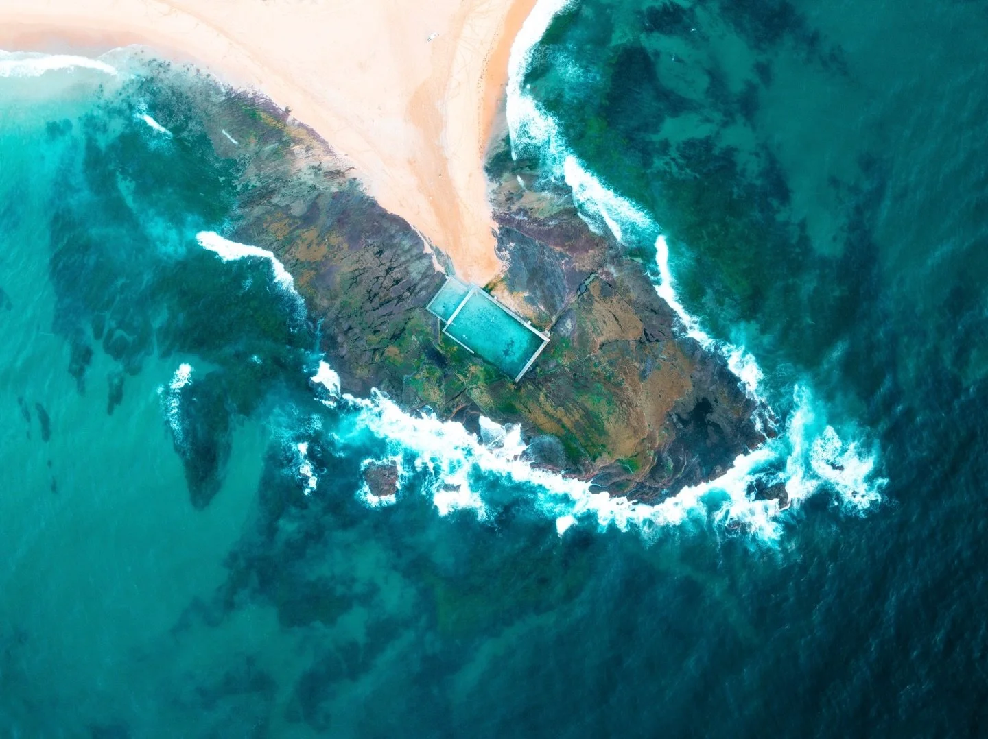 Yesterday morning above Mona Vale Rock Pool.
From the air, the coastline reveals a completely different perspective &mdash; turquoise water swirling around the rocks, waves wrapping the headland, and the ocean pool sitting perfectly between land and 