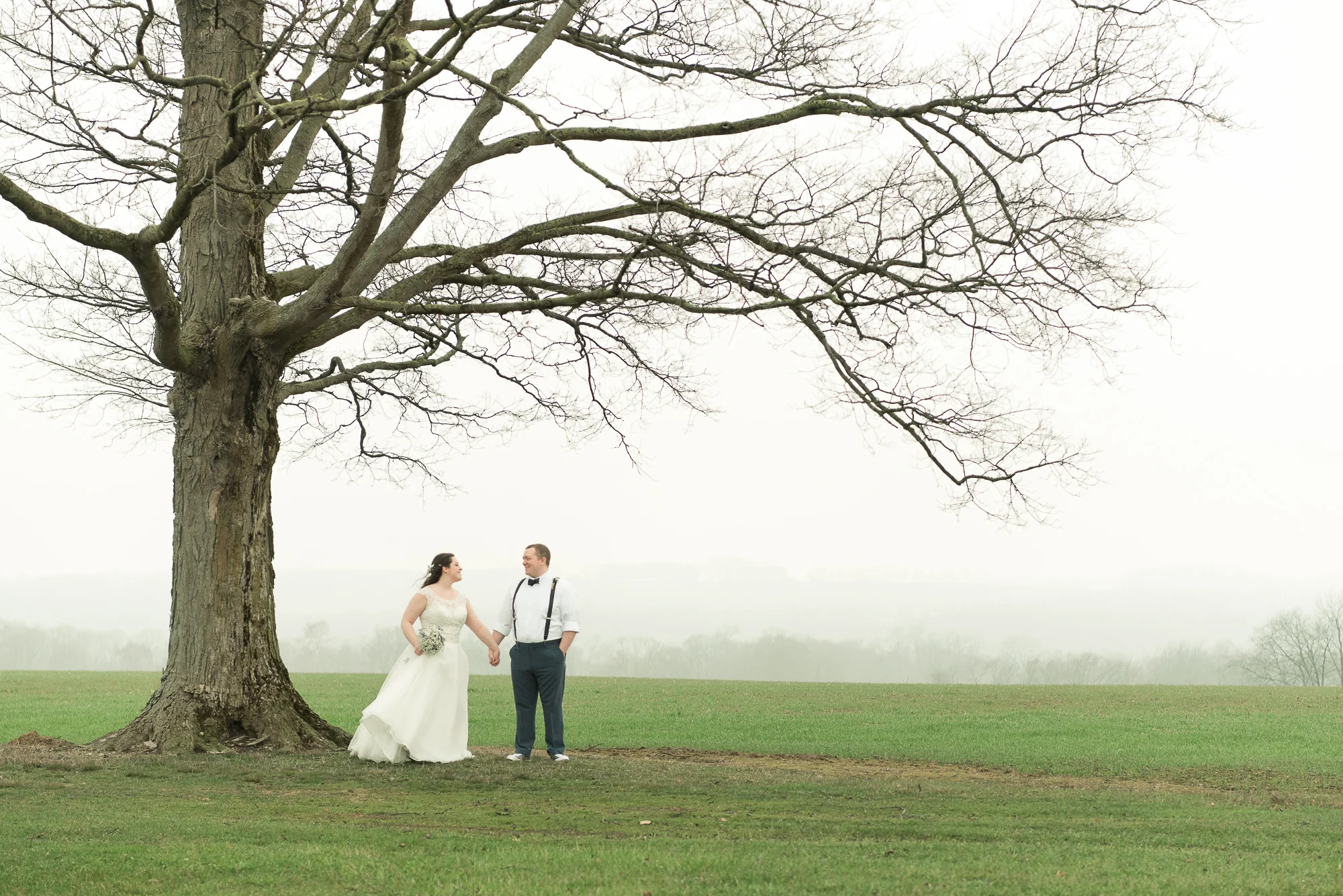 Well, it did rain, but as we left the church it tapered off, and by the time we reached the reception venue all that was left was this beautiful mist on the horizon which added a dreamy, romantic quality to these outdoor shots. The setting fit our couple - calm and serene. Throughout the day, Molly and Mackenzie exuded calm (not always a common occurrence at weddings!), and they were up for anything we asked of them, happily enjoying the day they became husband and wife. Look for more from Molly & Mackenzie's wedding; we'll be recapping more on the day and posting many more images very soon!