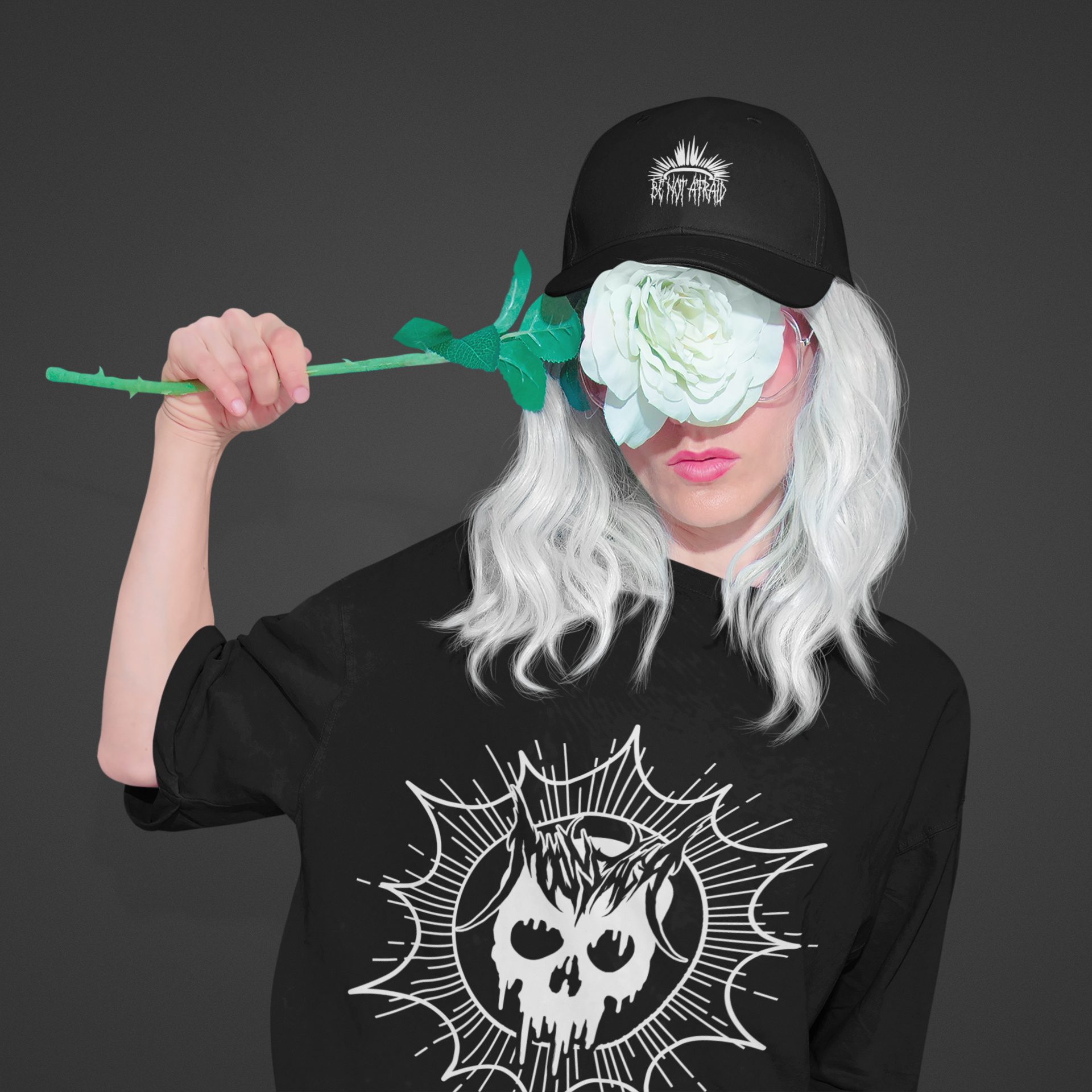 mockup-of-a-woman-wearing-a-tee-and-a-cap-while-covering-her-face-with-a-flower-43088-r-el2 (1).png