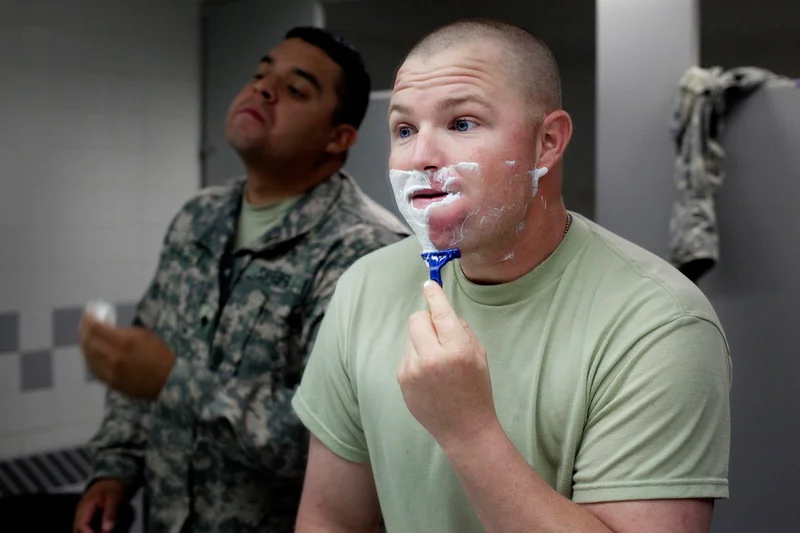  Specialist Stephen Hyser from California takes a shave in the bathroom of Bangor International Airport after returning from 12 months in Iraq with the US ARMY. Hyser is returning from his first tour of Iraq. The Maine Troop Greeters, a non-profit or