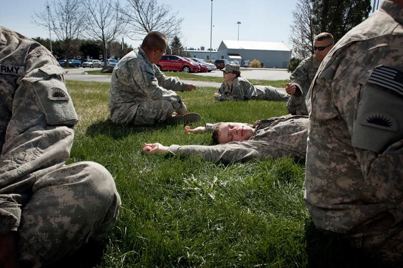  Soldiers from the US Army are overwealmed by the first glimpse of grass. 'All we had in Iraq was dirt and sand.' 20 year old Private Second Class Joe Hamilton from Oregan, 141 Brigade Support Battalion embraces some morning sunlight after returning 