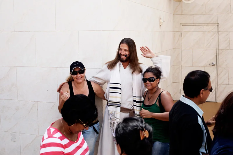  Visitors pose for photographs after the Last Supper which is scheduled 12 times daily. 