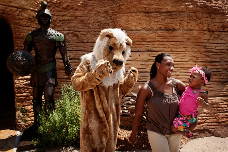  A costumed staff member frightens a small child. 