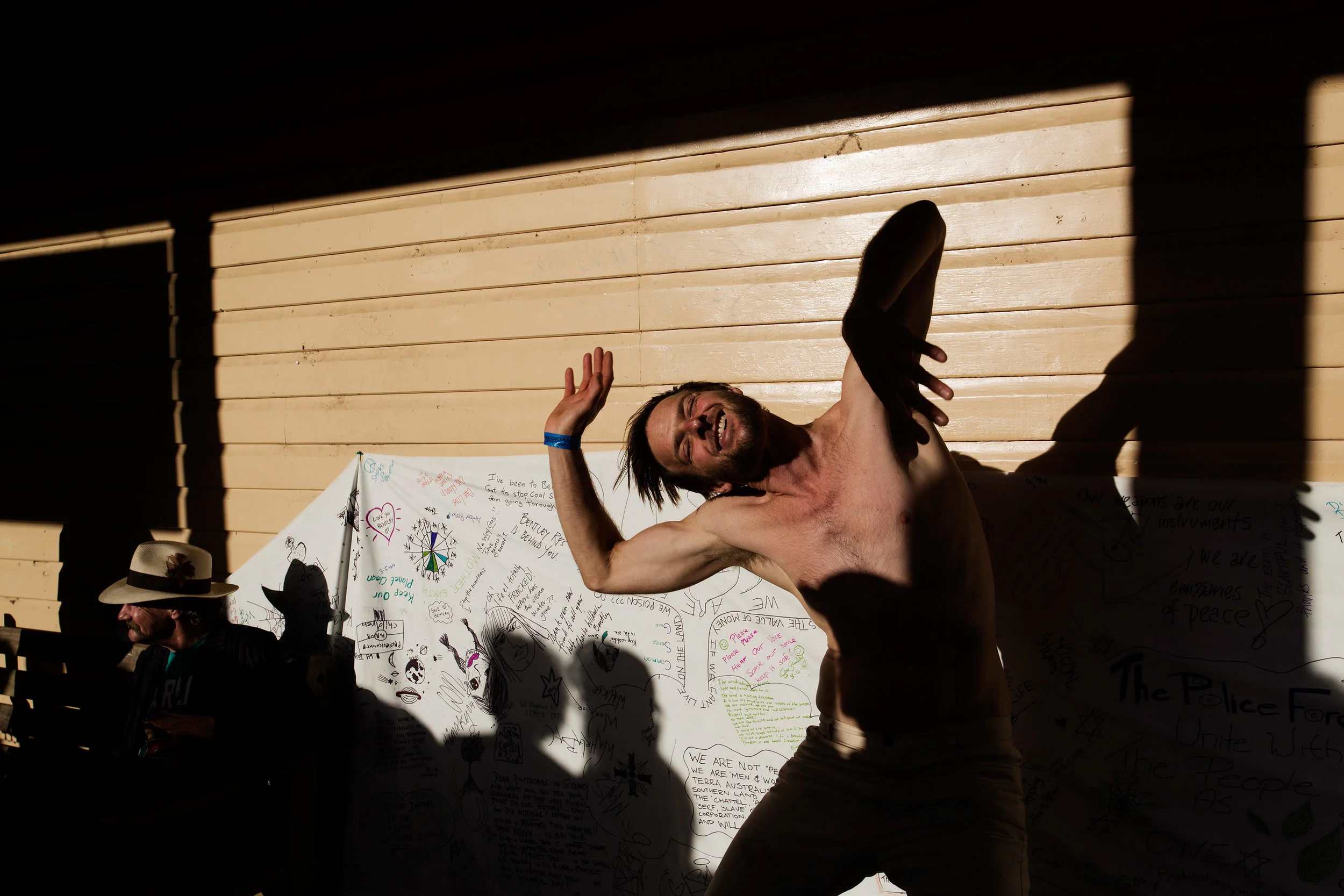  A man dances to the sound of a street performer's music on Cullen Street, Nimbin NSW, Australia. 