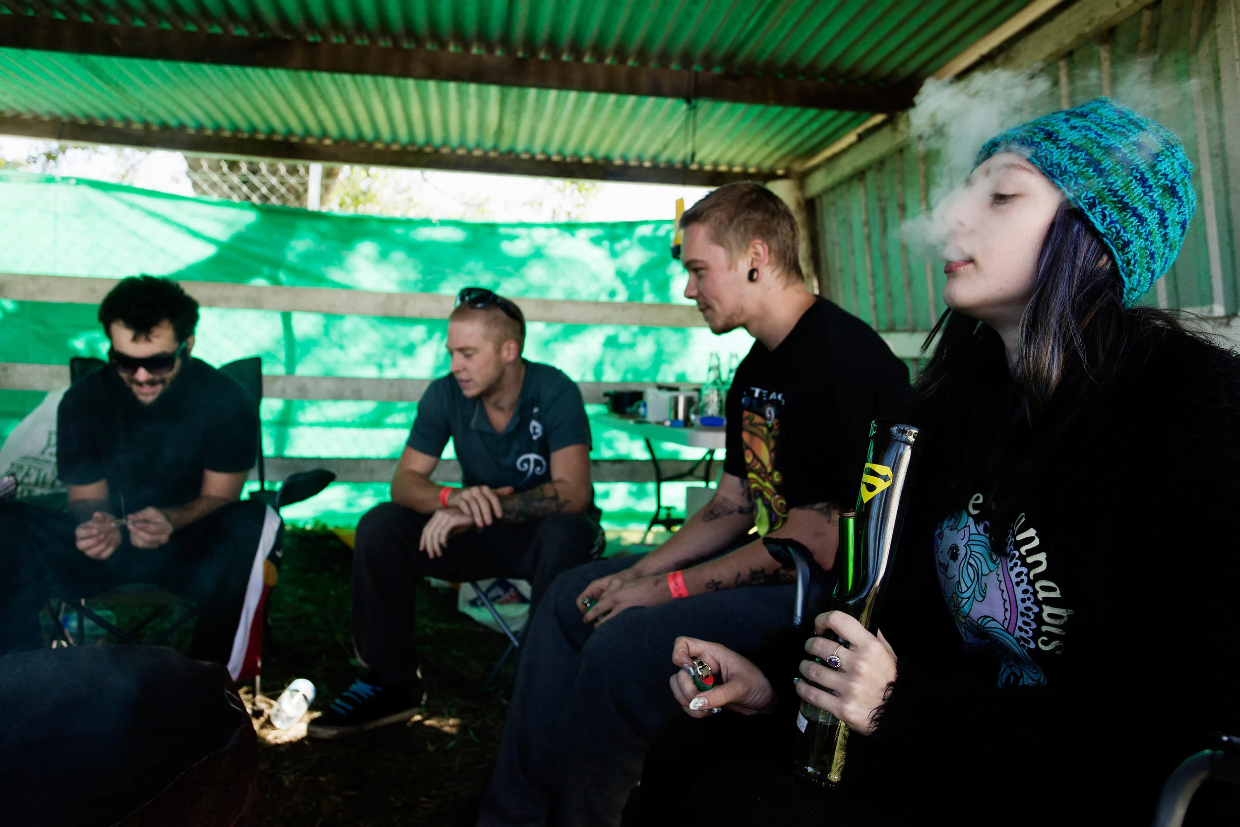 From left: Ayden Hughes, Matthew Fowler, Beau Phillips and and Ashley Brooke enjoy a bong together before breakfast at the showgrounds campsite, Nimbin NSW, Australia. On the topic of law enforcement, Ayden comments, "Pot smokers are the easiest to 