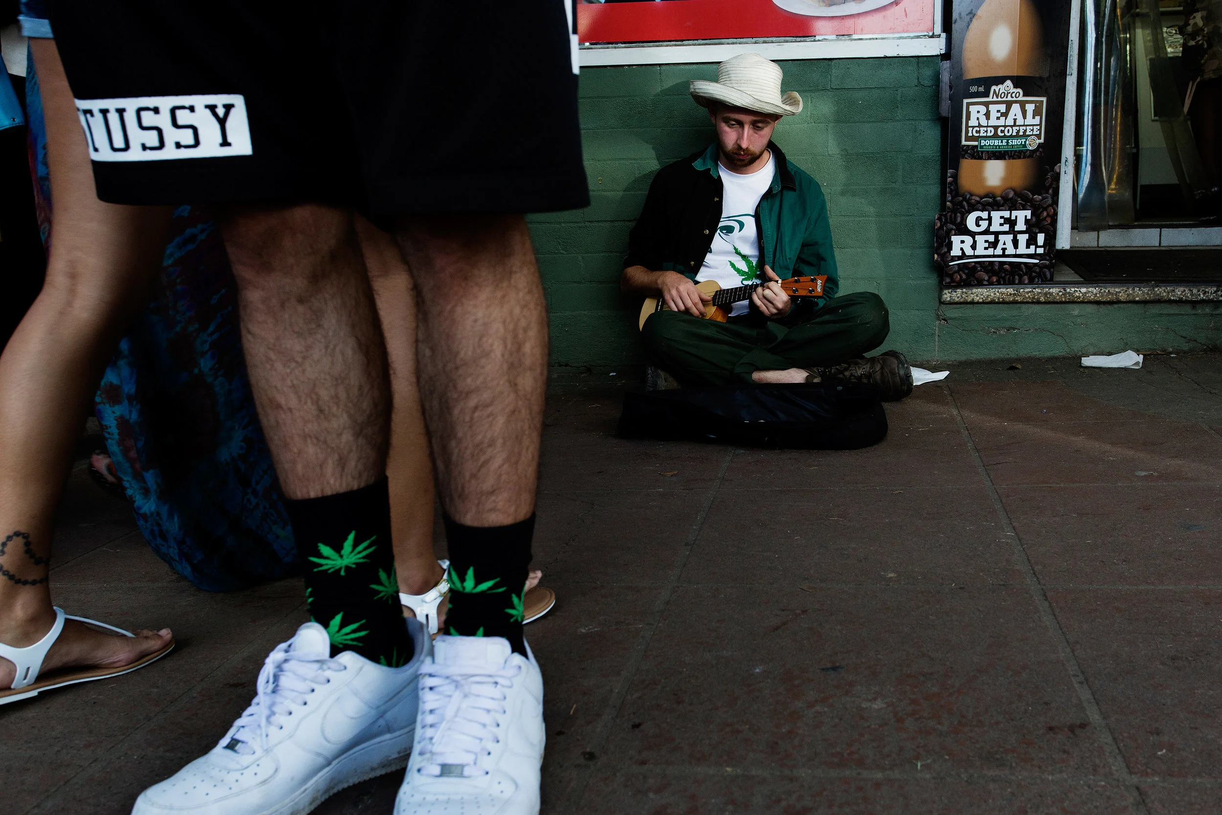  Harvey Bruce from London plays guitar for passers by on Cullen Street, Nimbin NSW, Australia. He moved to Nimbin to work on a permaculture and biodynamics project.&nbsp;  "It's a deep place and people are very sincere. I'll be here until they kick m