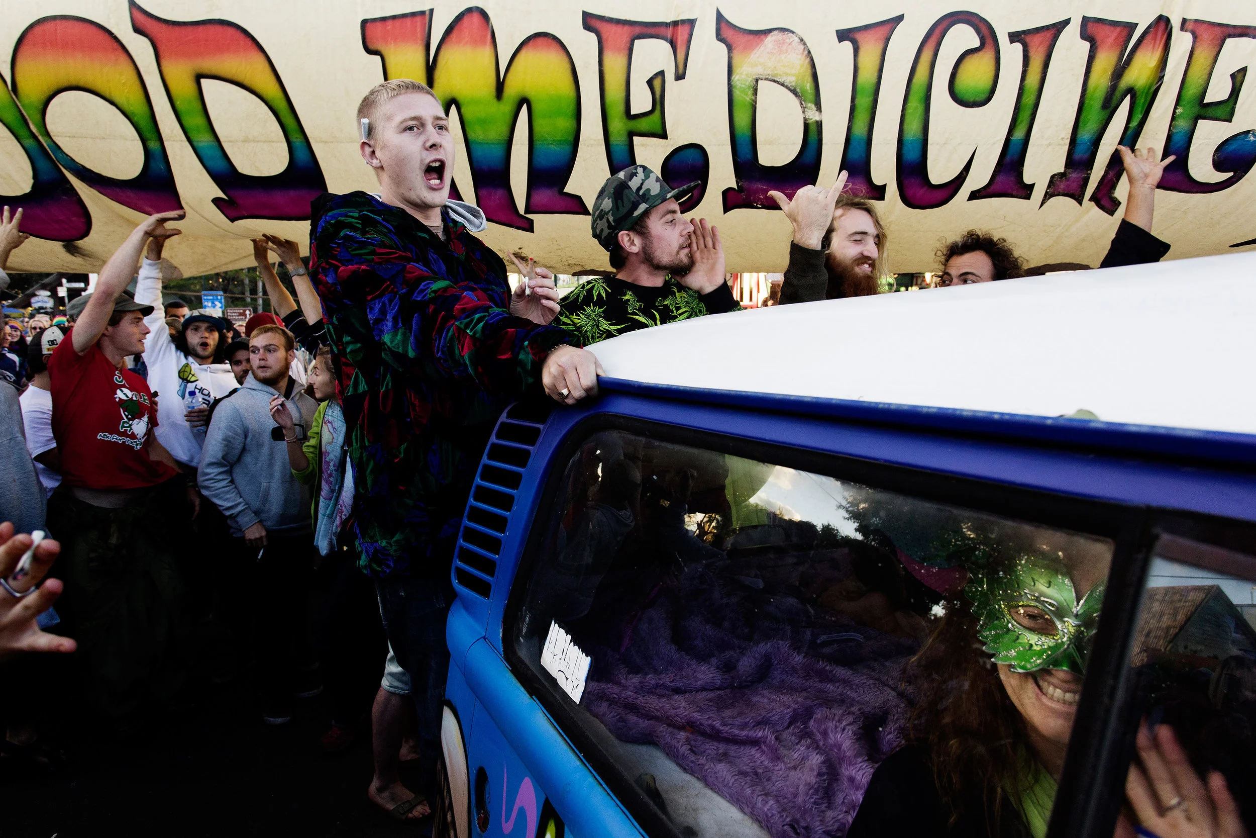  The 'Kombi Konvoy' parades down Cullen Street in Nimbin NSW, Australia. Thousands of cannabis activists lit their joints at 4.20pm in support of law reform, despite a heavy police presence. 