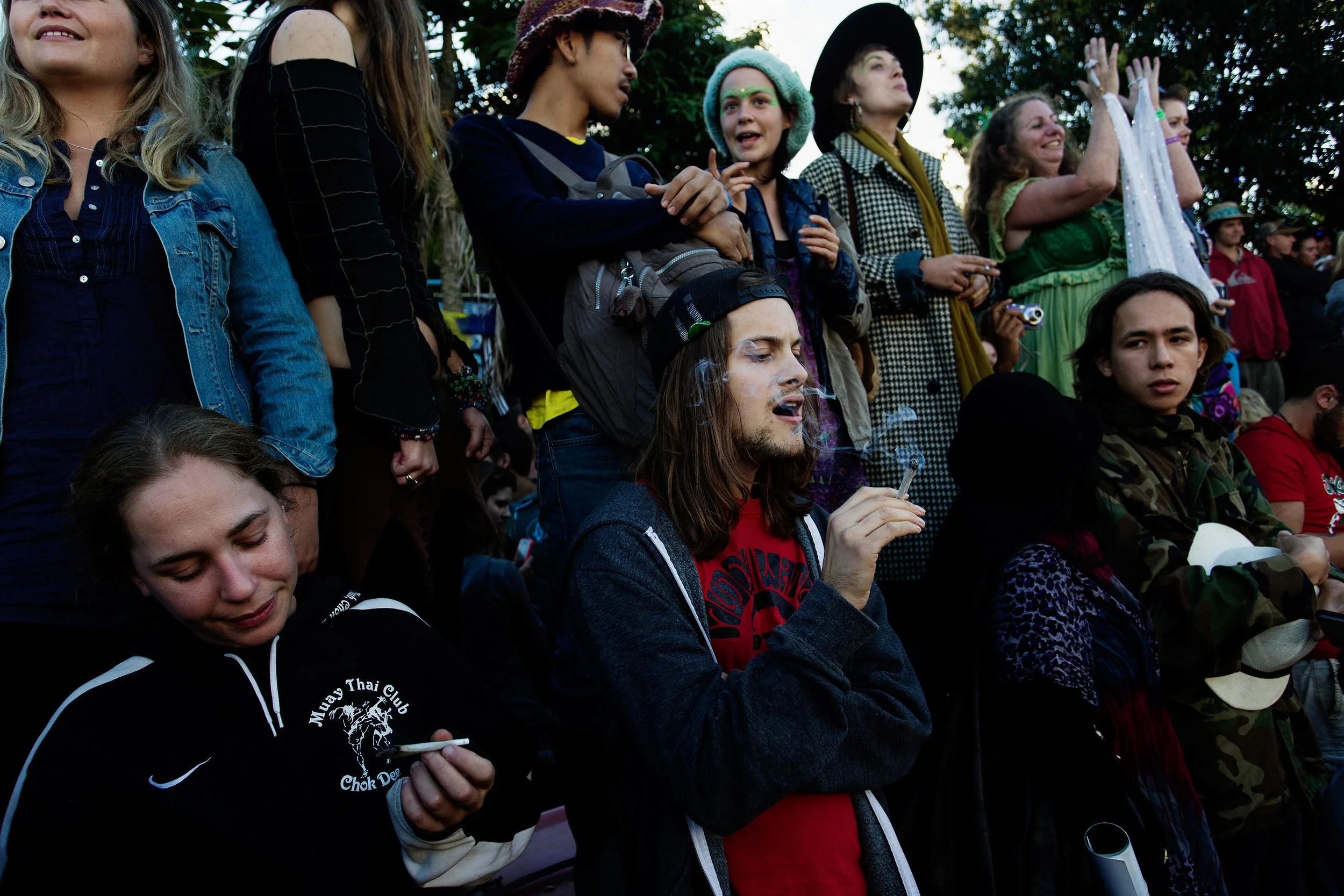  Revelers on Cullen Street smoke joints during the parade in Nimbin NSW, Australia. 