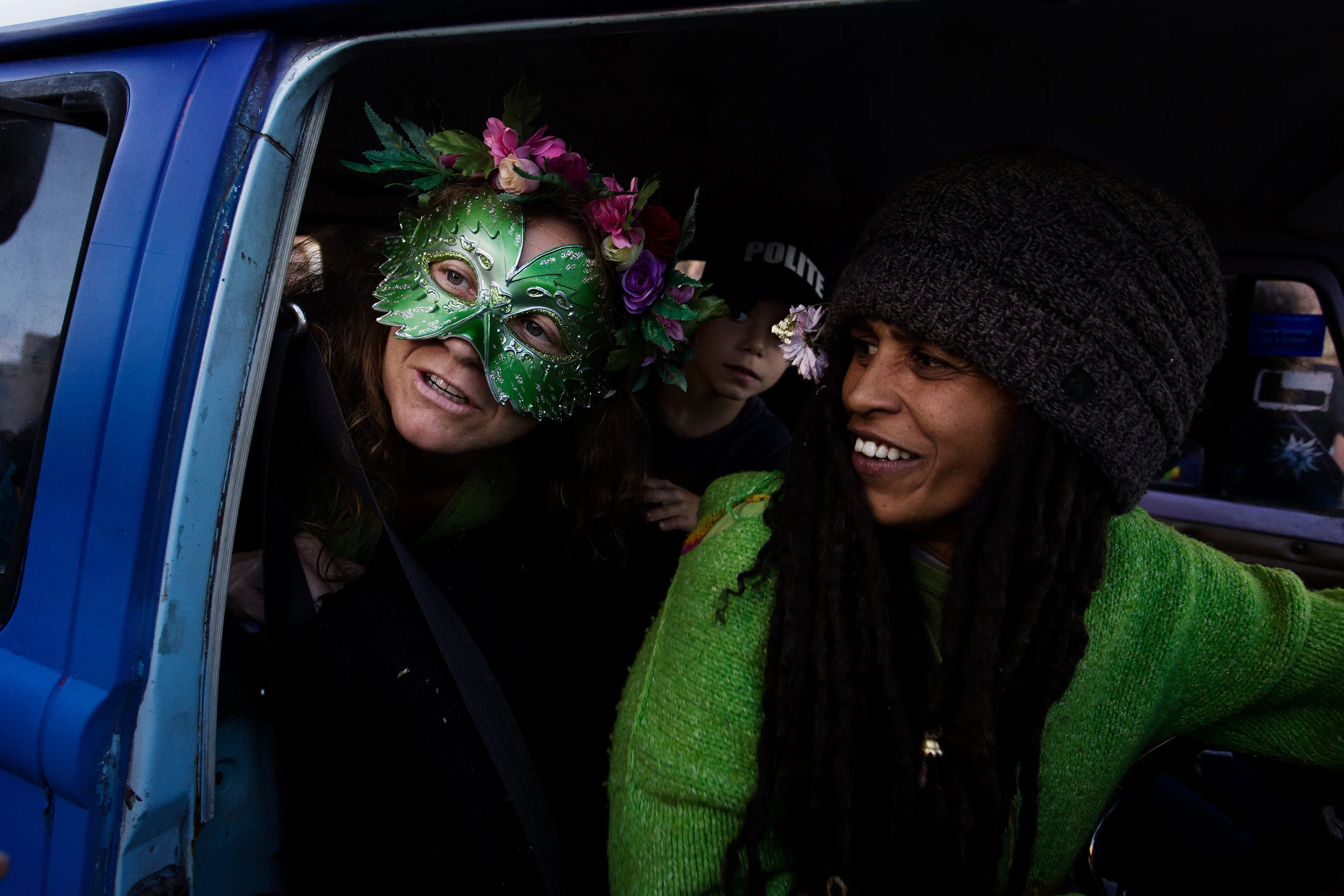  The Kombi Convoy parades down Cullen Street at 4.20pm, carrying enthusiastic cannabis supporters and entertaining large crowds of onlookers, Nimbin NSW, Australia. 